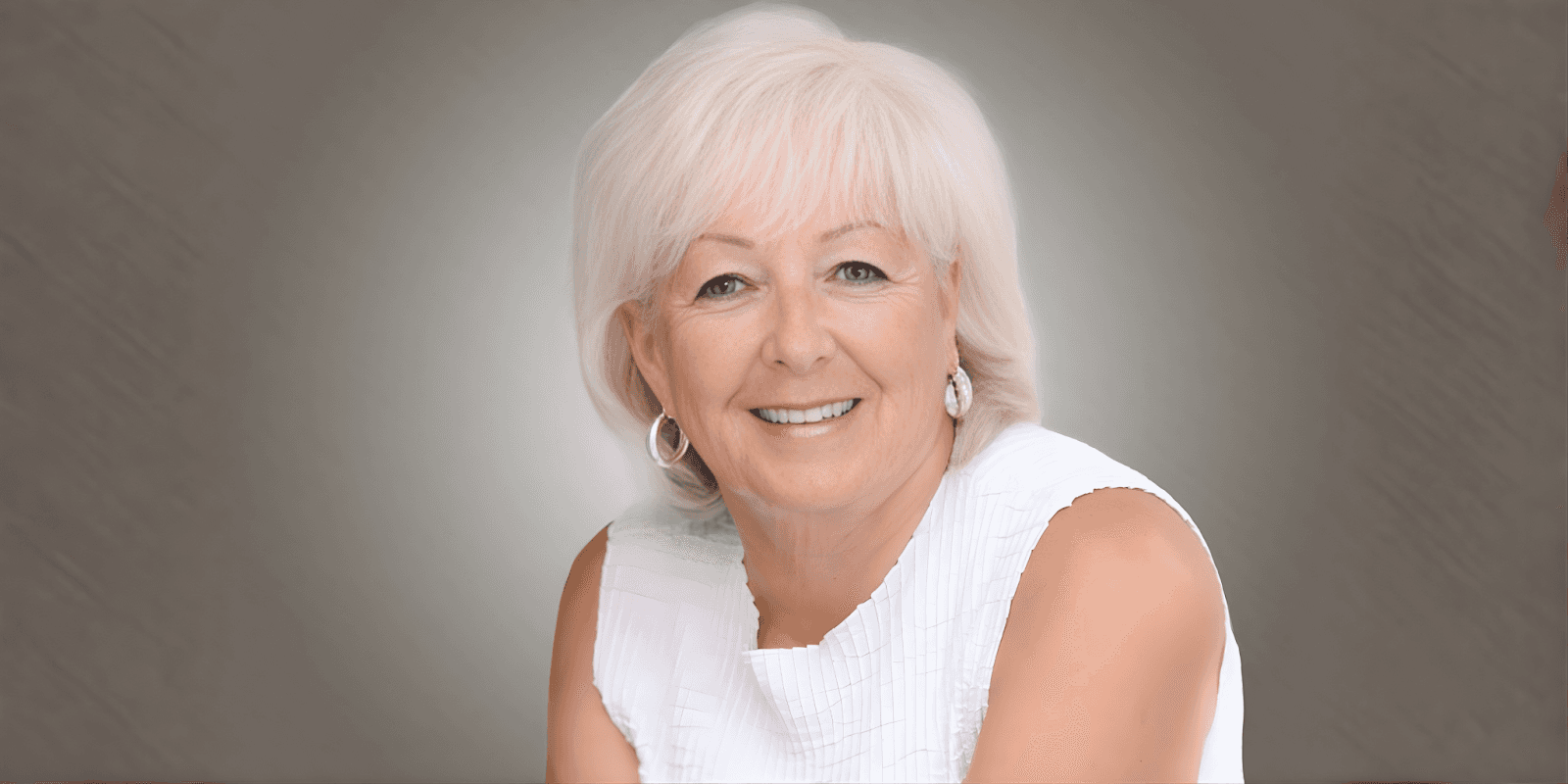 "Patricia Sands, bestselling author of women’s fiction, smiling while holding her book, exemplifying resilience, empowerment, and second chances in life."