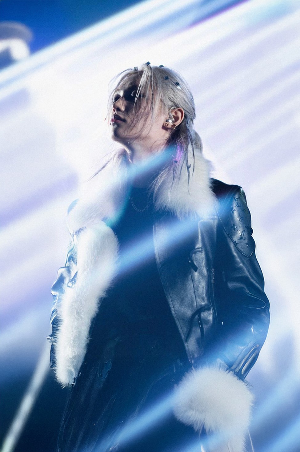 Felix of Stray Kids performing at a concert, photograph via Louis Vuitton