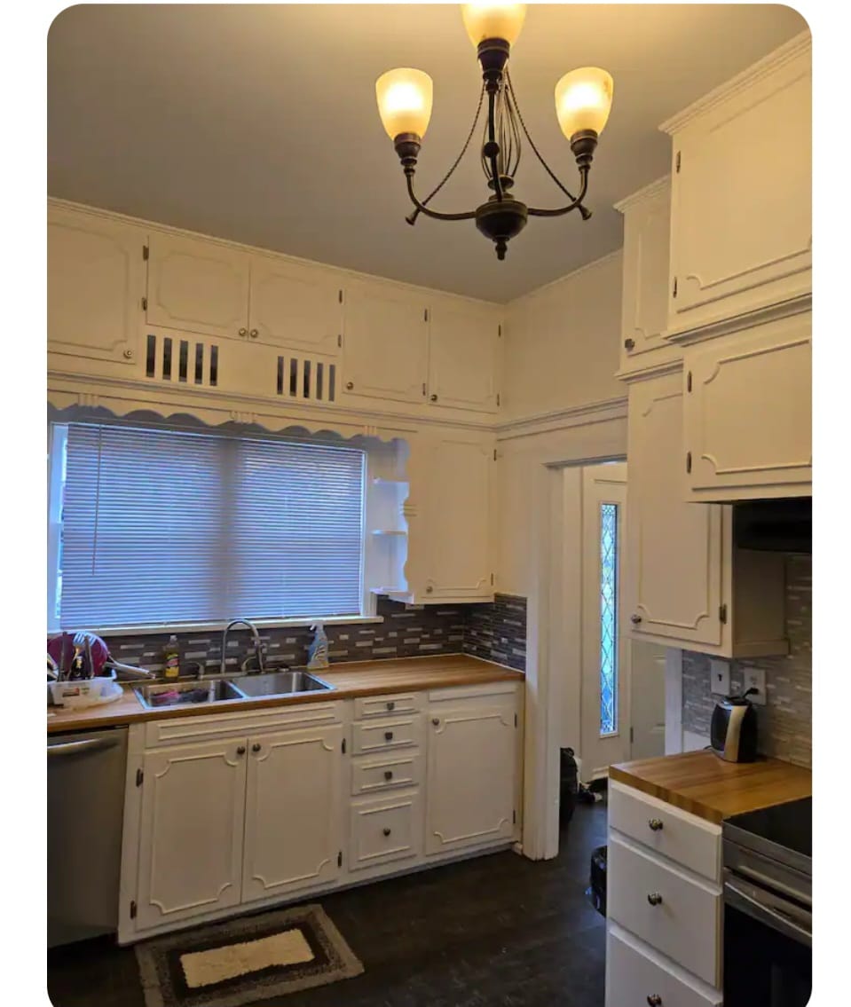 kitchen with two brown wooden chairs