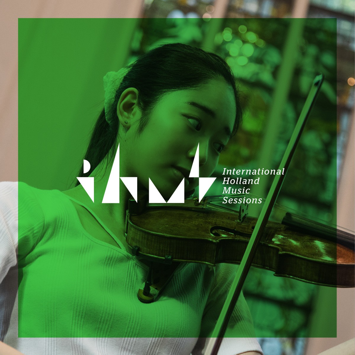 White IHMS logo on green background