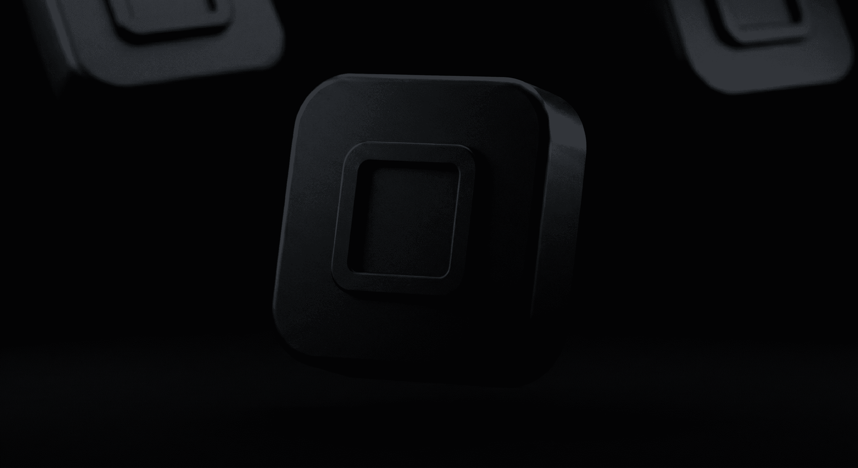 a close up of a black object with a black background