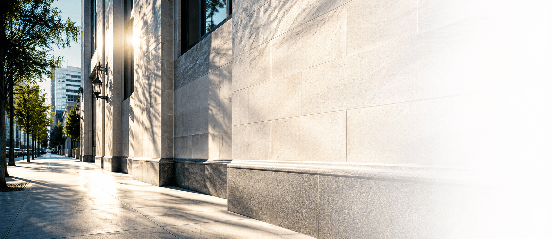 Technician-applied RexPro® anti-graffiti protective coating on a commercial building exterior.