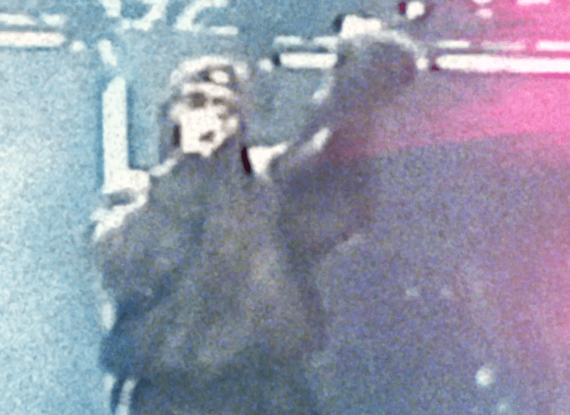 Woman in black outfit sitting on floor