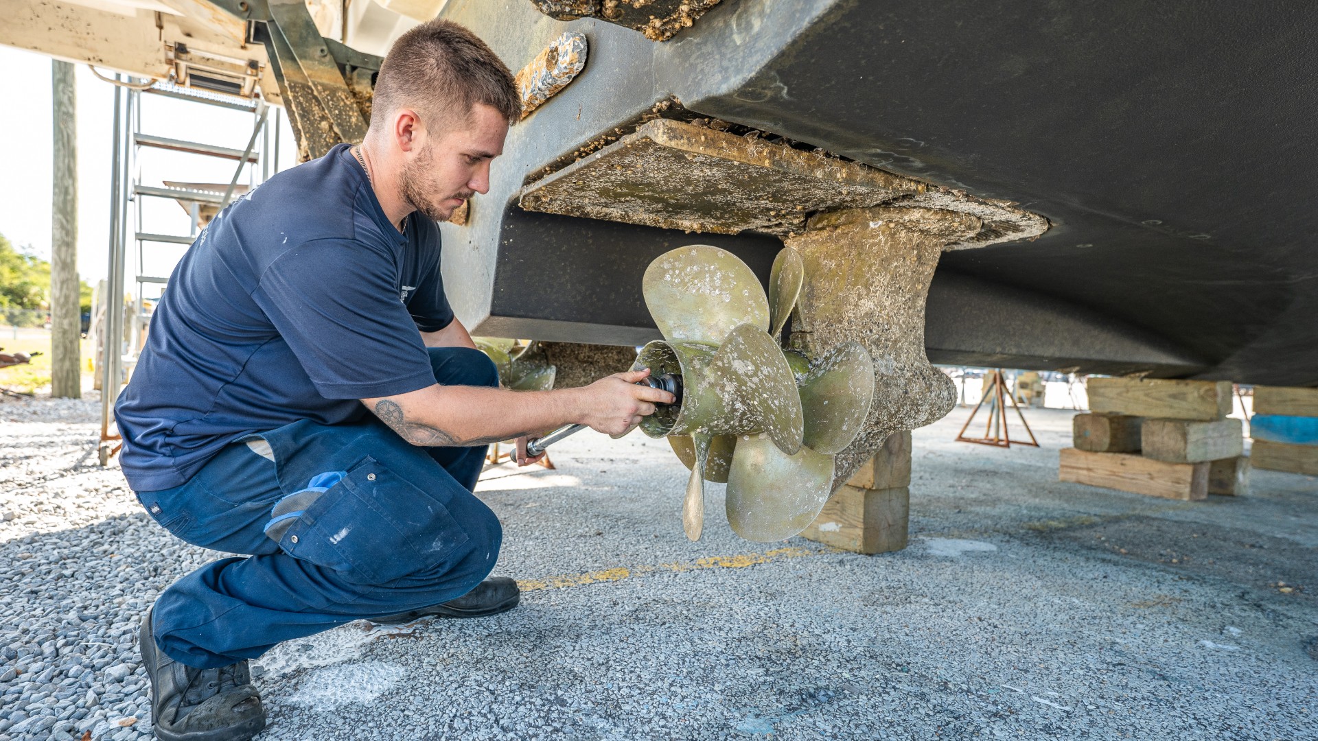 Southeastern Marine employee inspecting an inboard yacht propeller