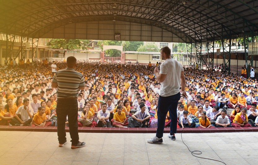 Men on stage preaching the Gospel