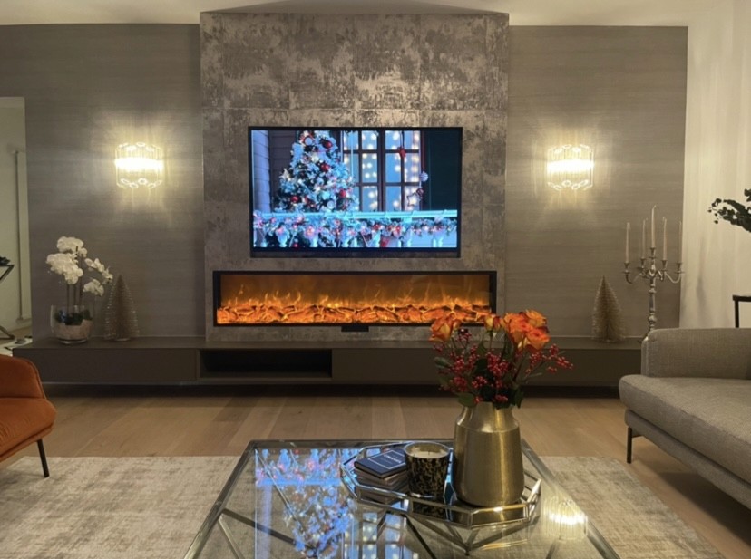Modern living room with vertical garden, yellow sofas, and stylish coffee tables.