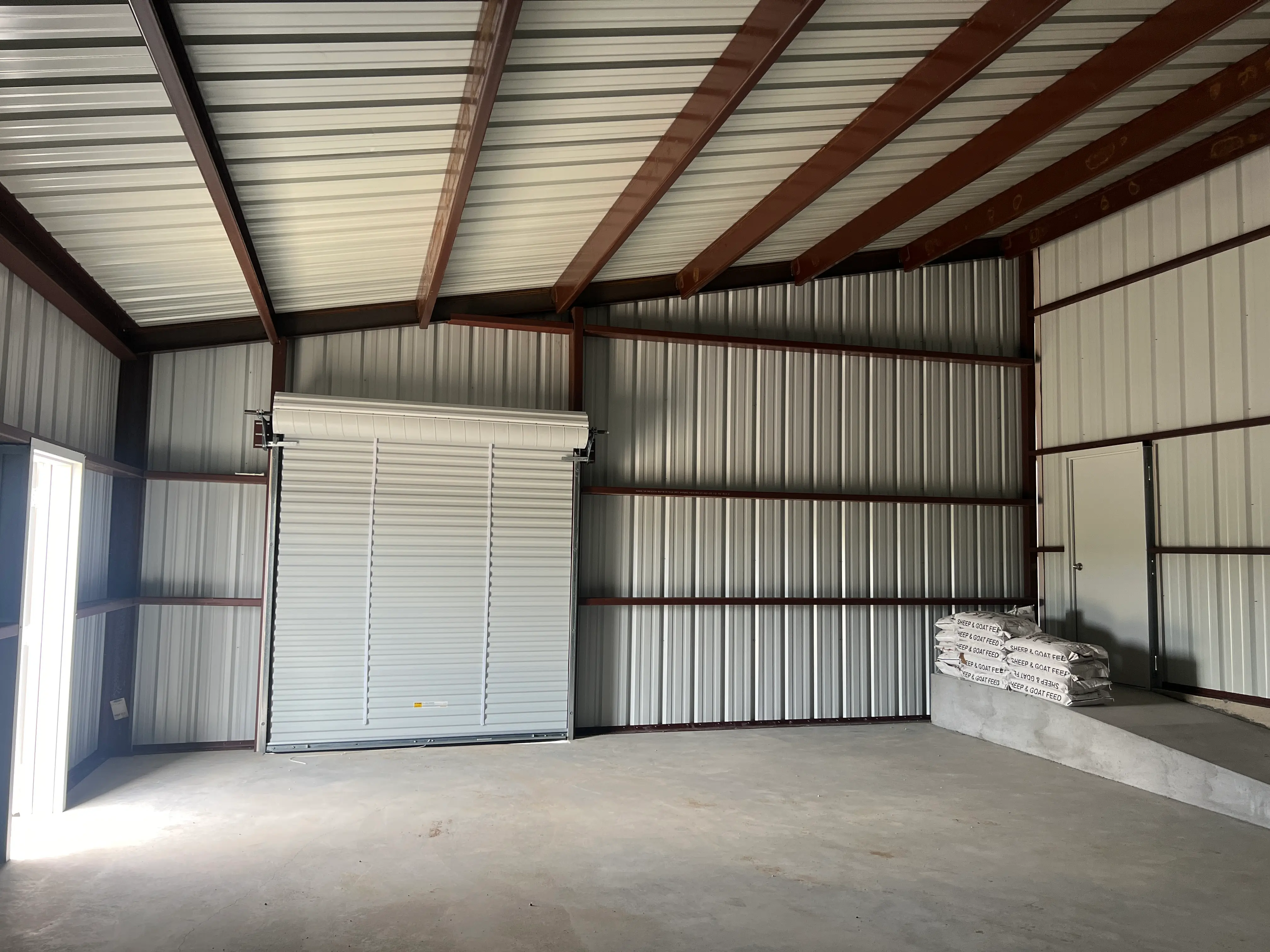 Two Tier Ag Barn: East Interior with Ramp and Roll Up Door Gatesville, Texas Perks Metal Works