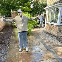 Group of men standing with Sufboard