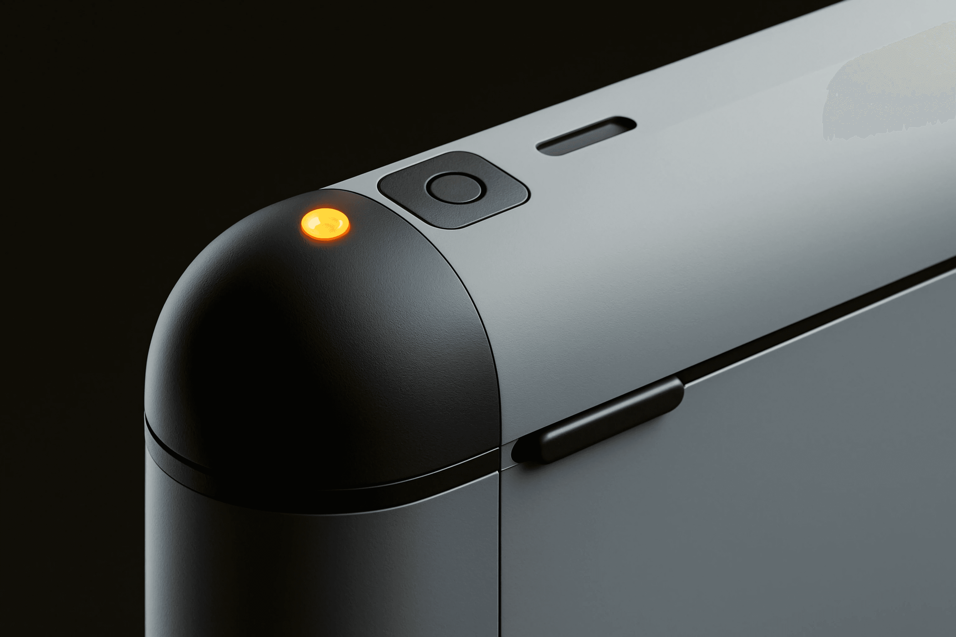 Close up of grey industrial device corner with orange indicator light