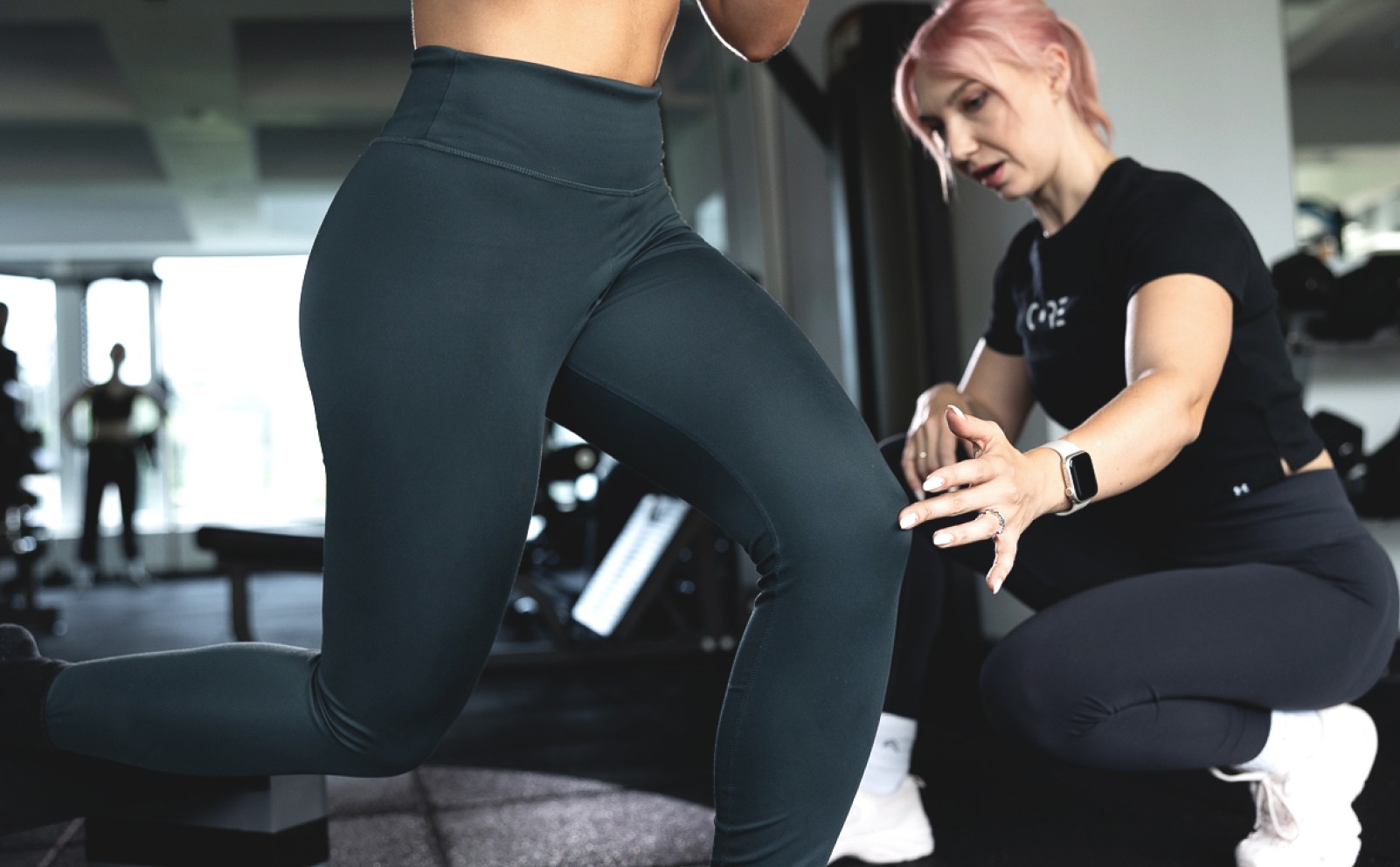 Personal fitness trainer with client