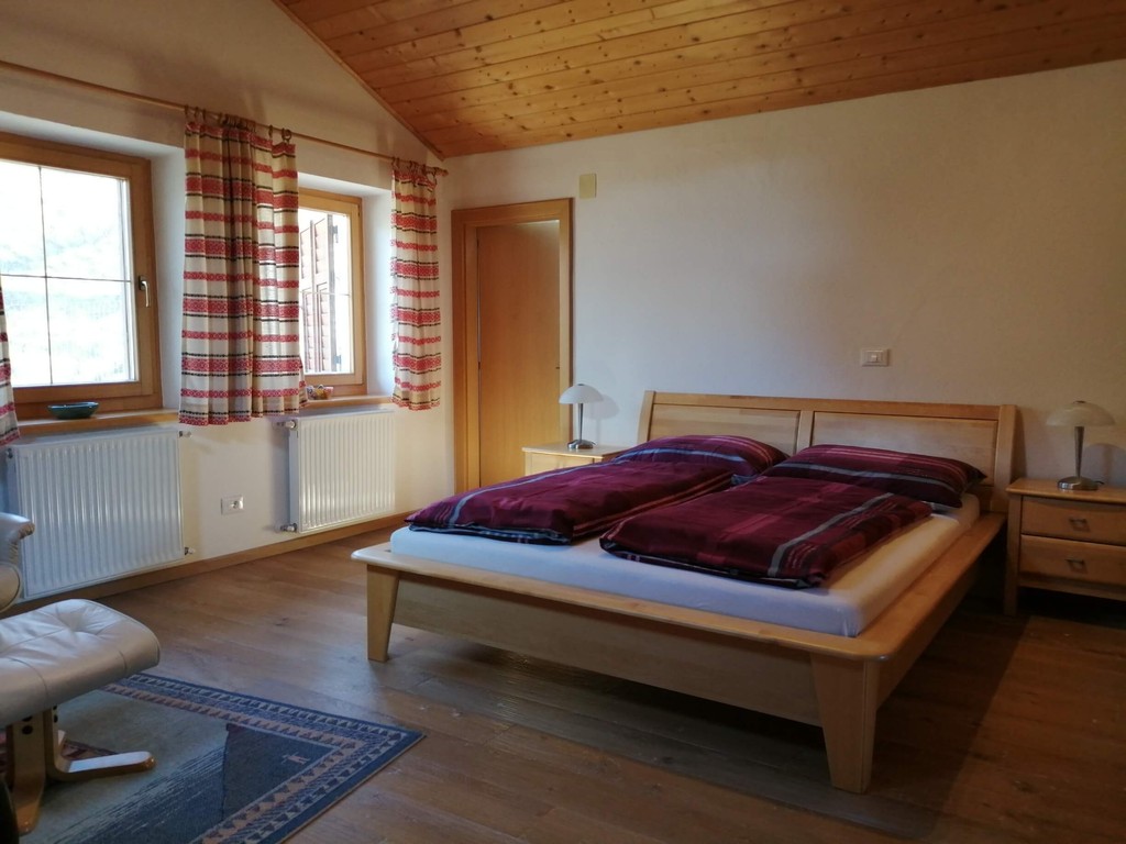 Master bedroom of the apartment with a double bed