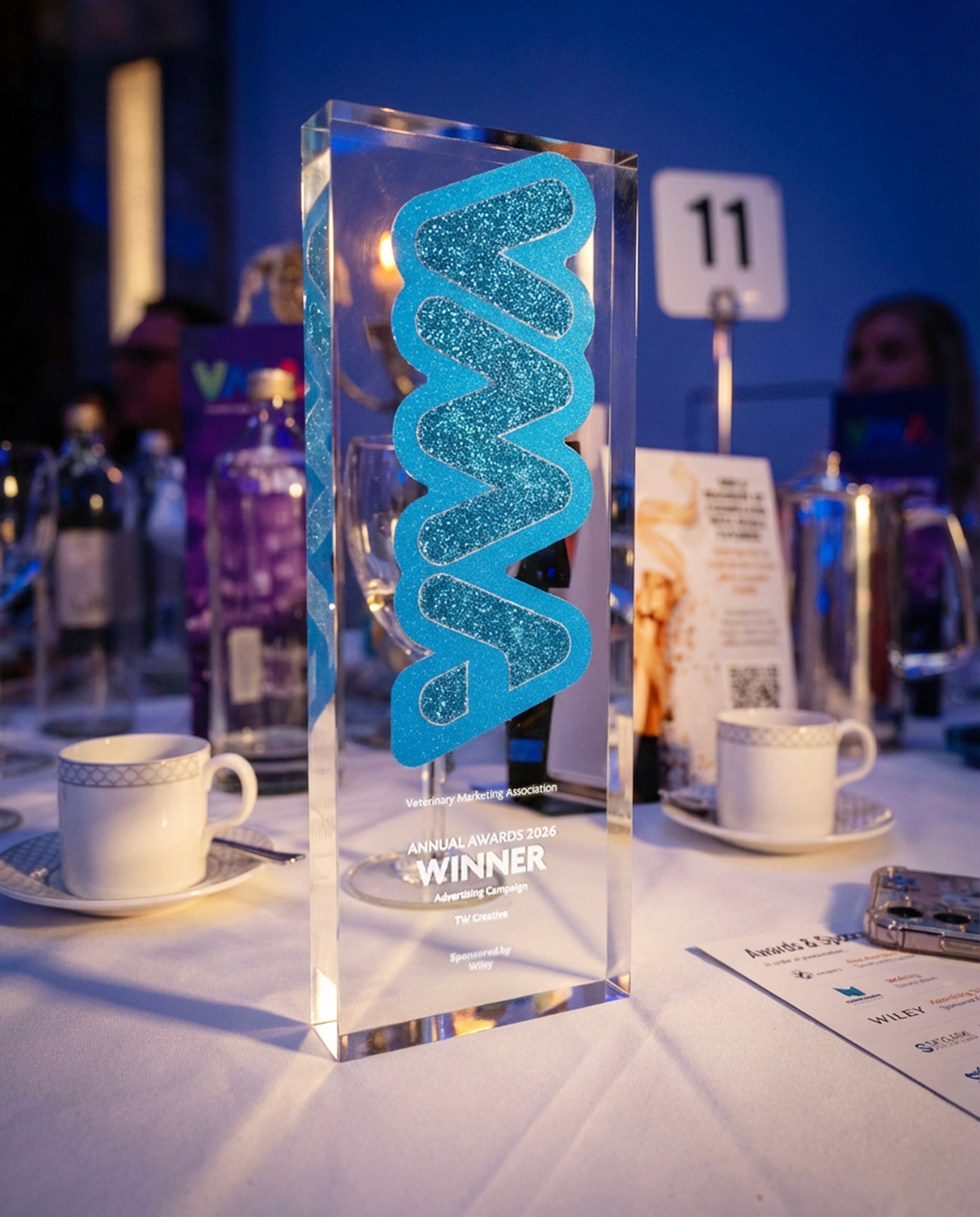 A yellow ping pong ball on a yellow background with TAKE A RISK printed on it