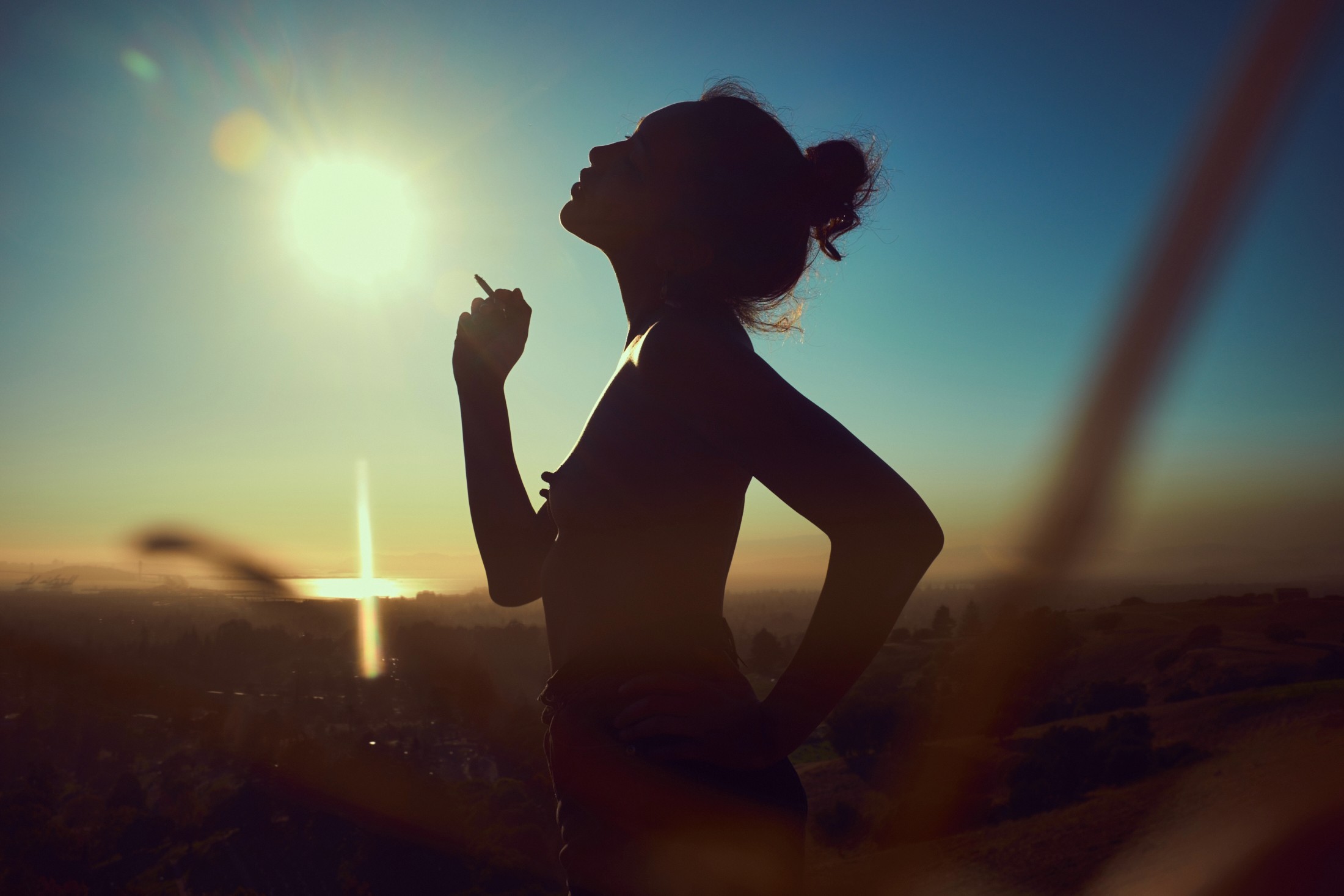 Natural light portrait of South Asian woman smiling with scarf