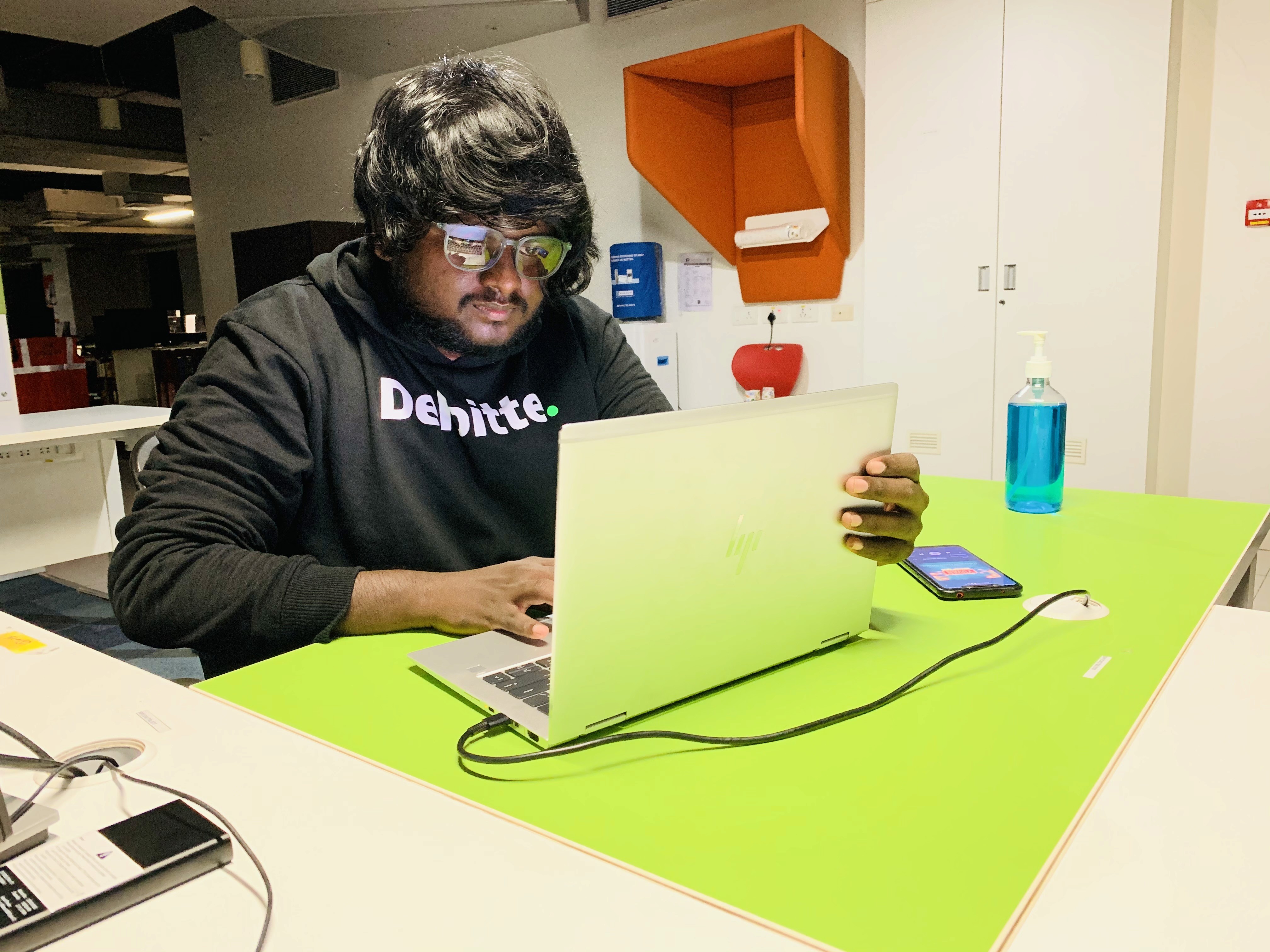 Black and white portrait of a man with a beard and glasses