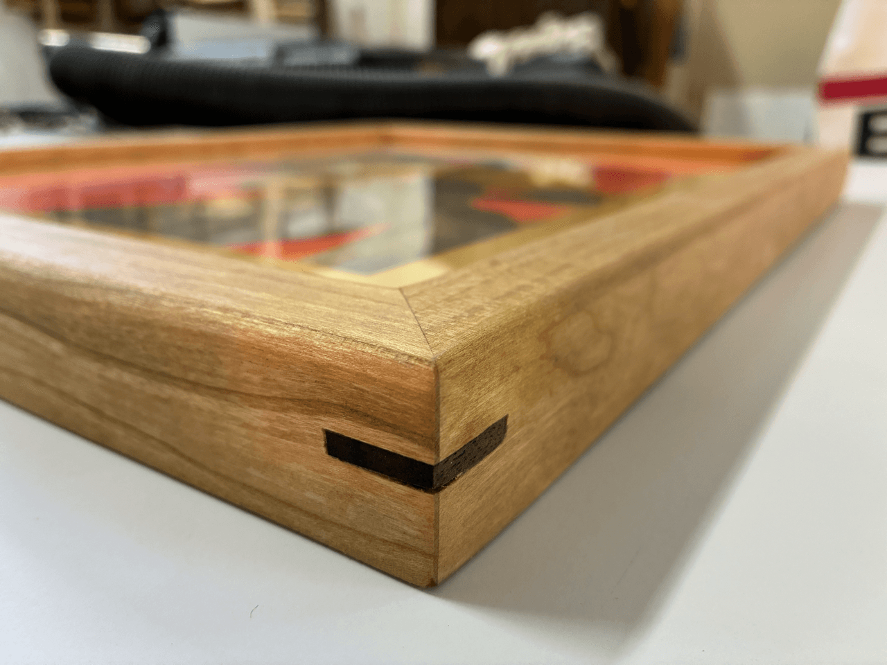 the corner of a custom frame showing the miter joint
