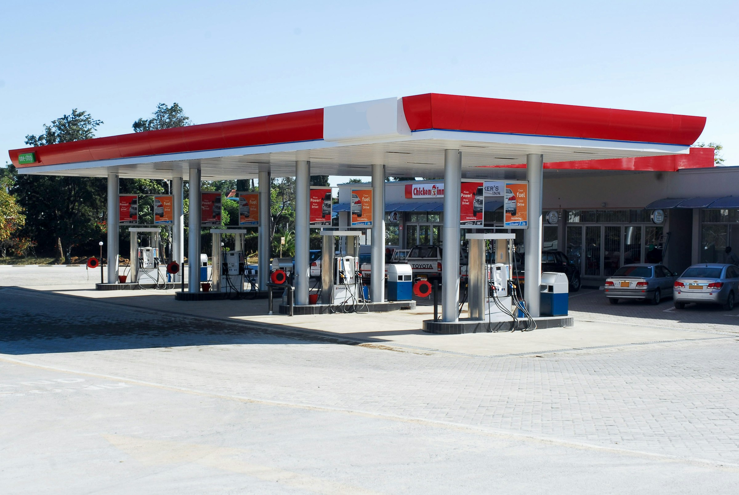 Fuel station, convenience store, and retail center