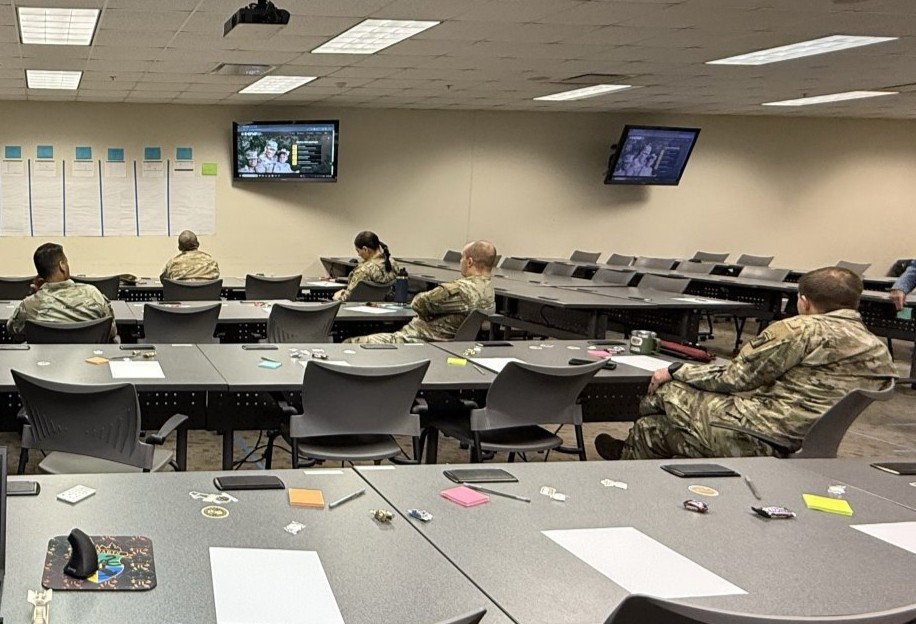 group of Army Soliders sitting at tables for a mapping workshop
