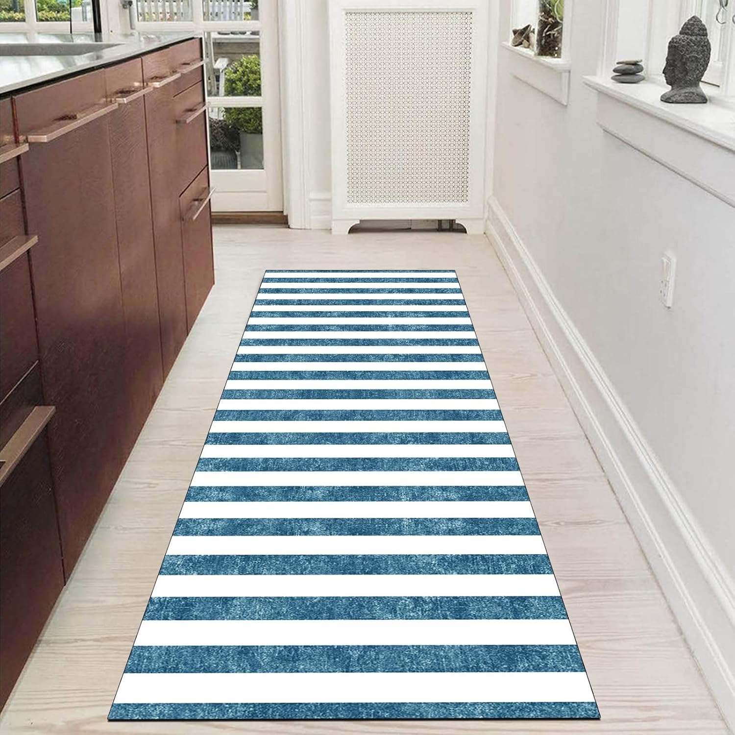 Blue and white runner rug enhances the room with its unique design.