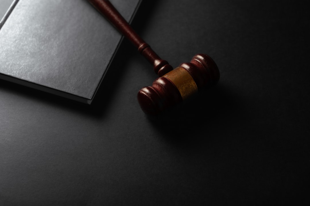 Legal gavel resting on a set of car keys representing a deficiency judgment case - auto repossession debt suit defense