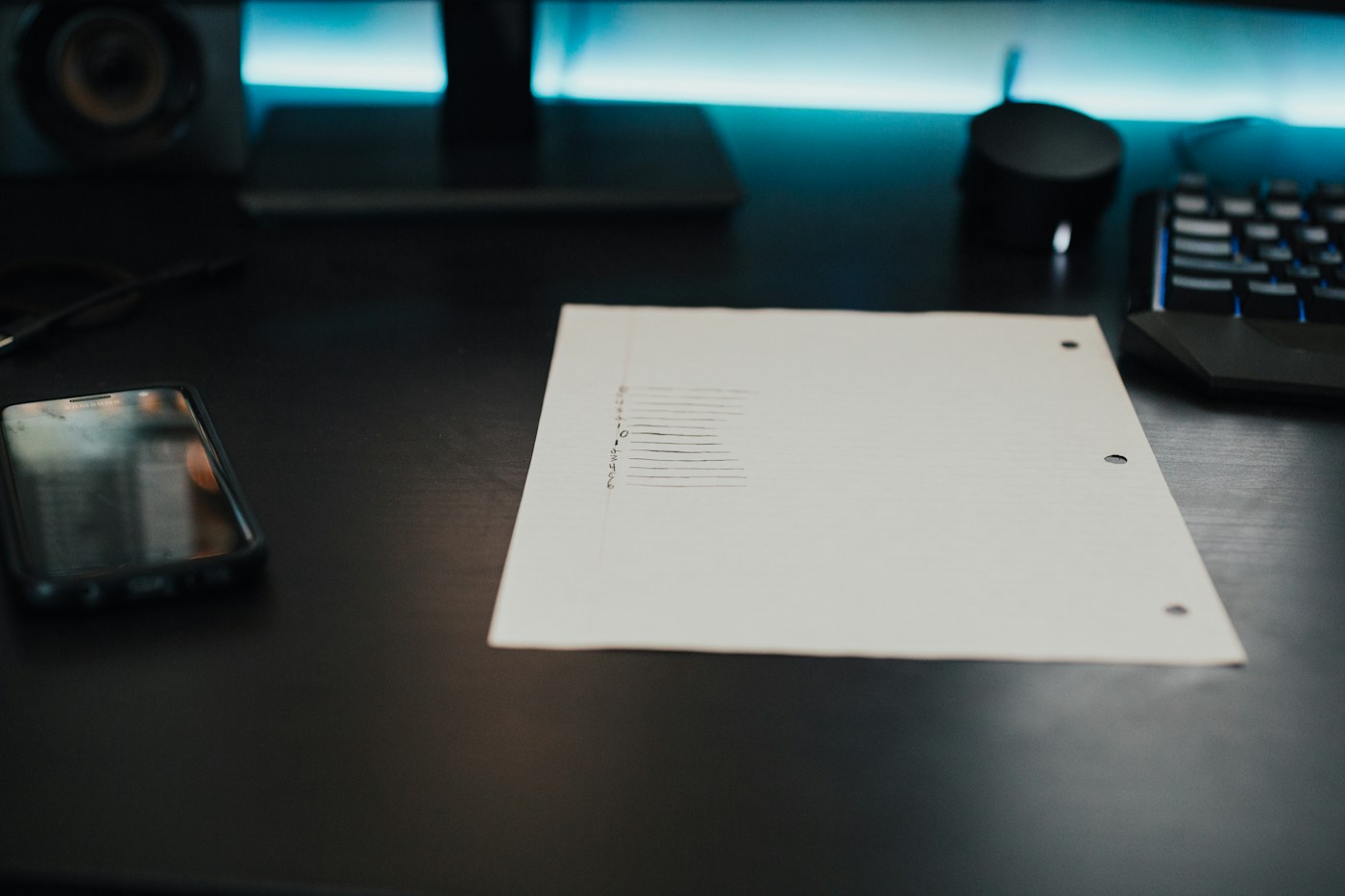 Printed production planning documents used as an editorial illustration for budget assumptions