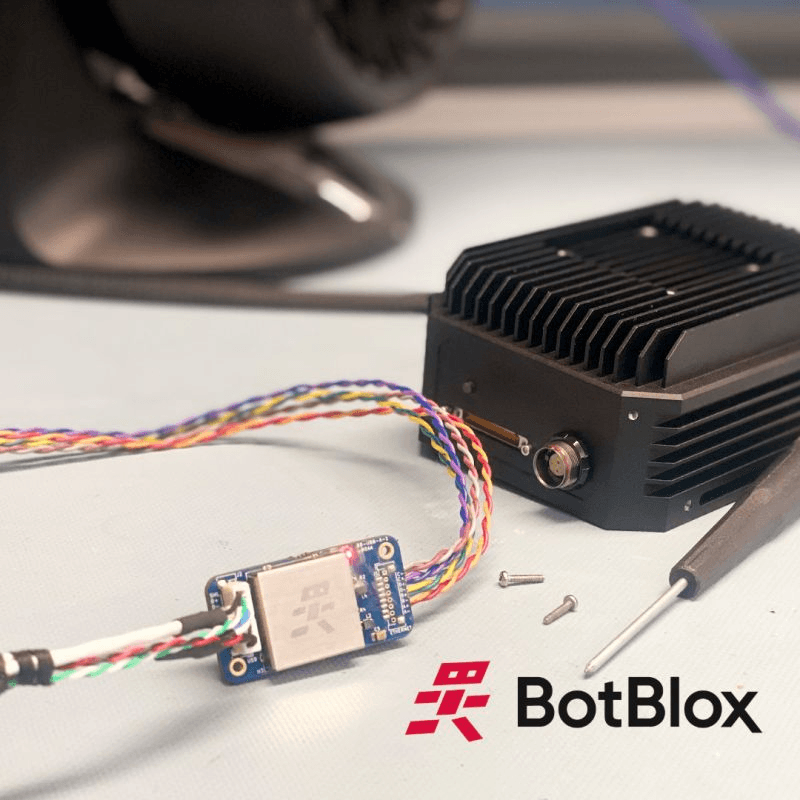 USBBlox with its EMI shield cabled to a ruggedized payload enclosure on the bench
