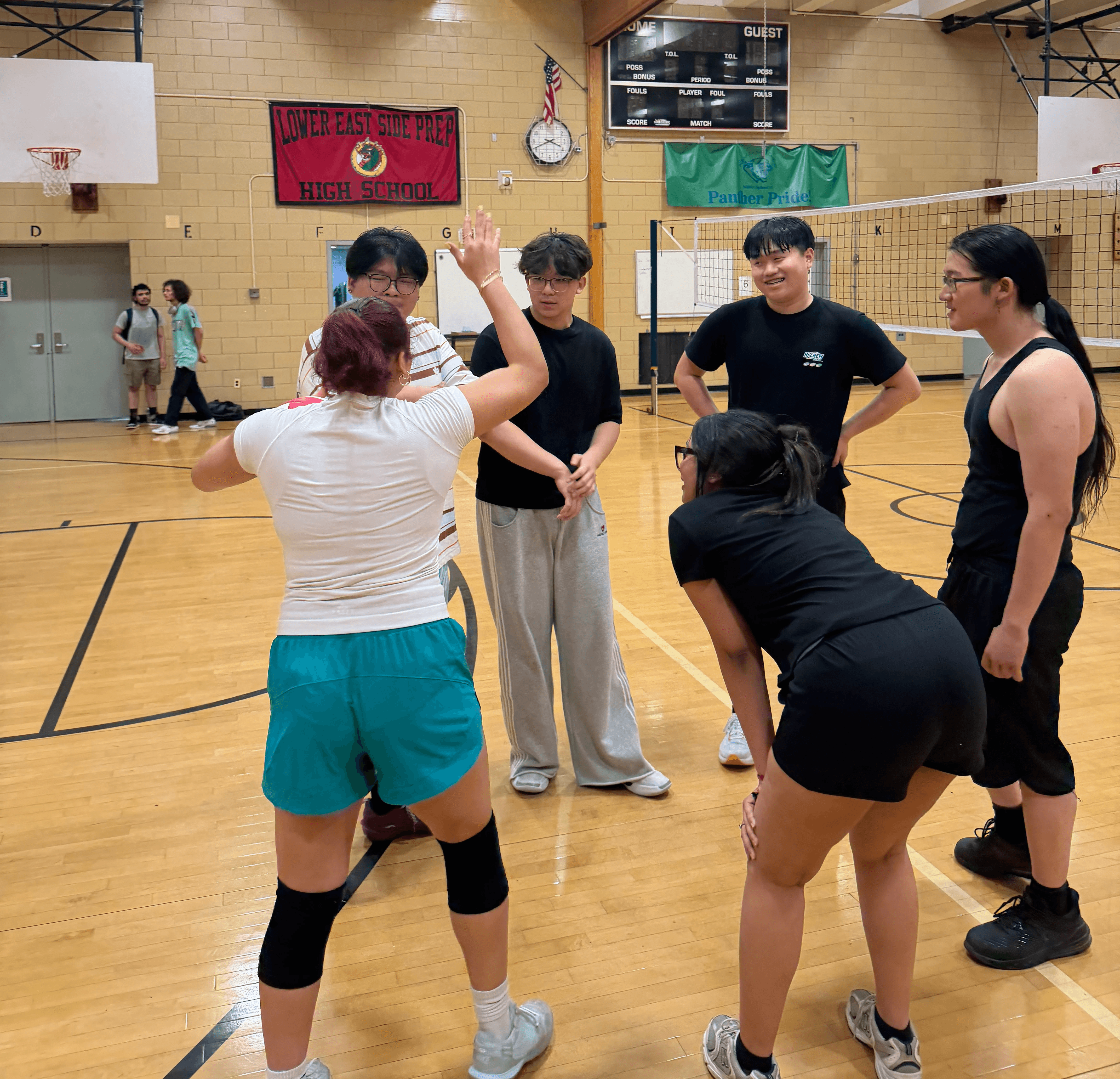 Students get pumpred up for a volleyball match.