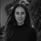 a man in a blue suit posing for a picture