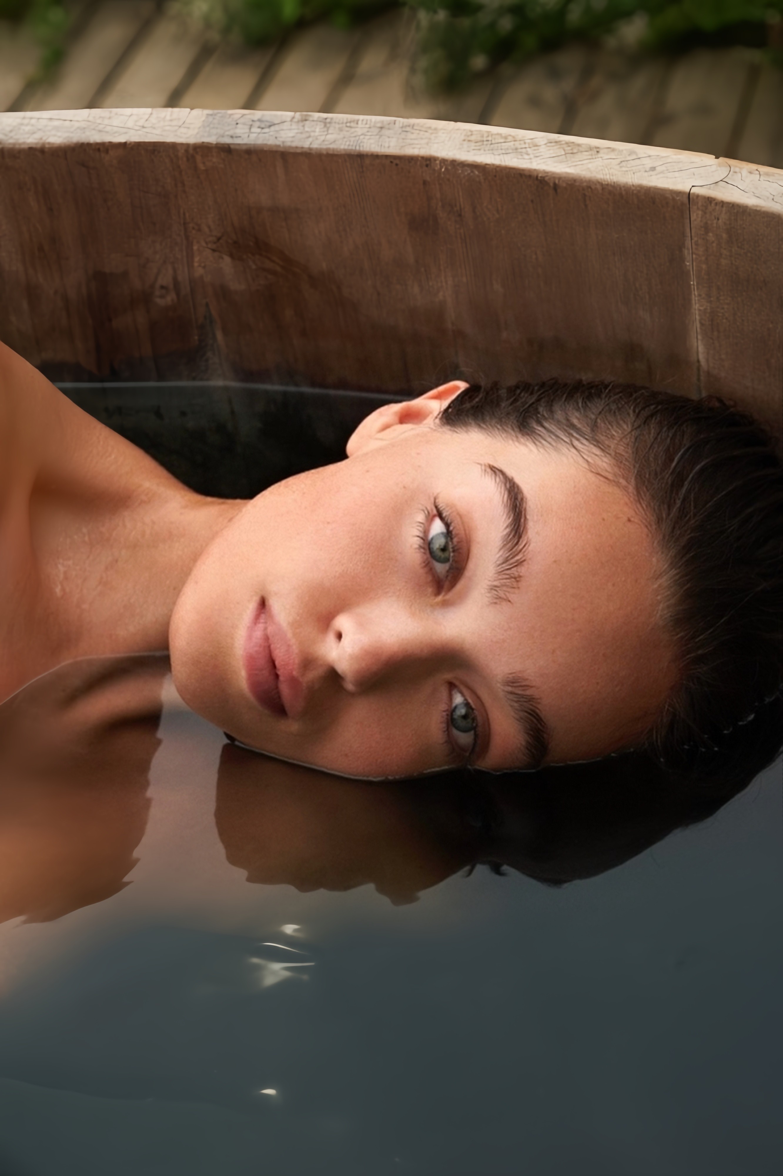 Laptop displaying website on wooden table