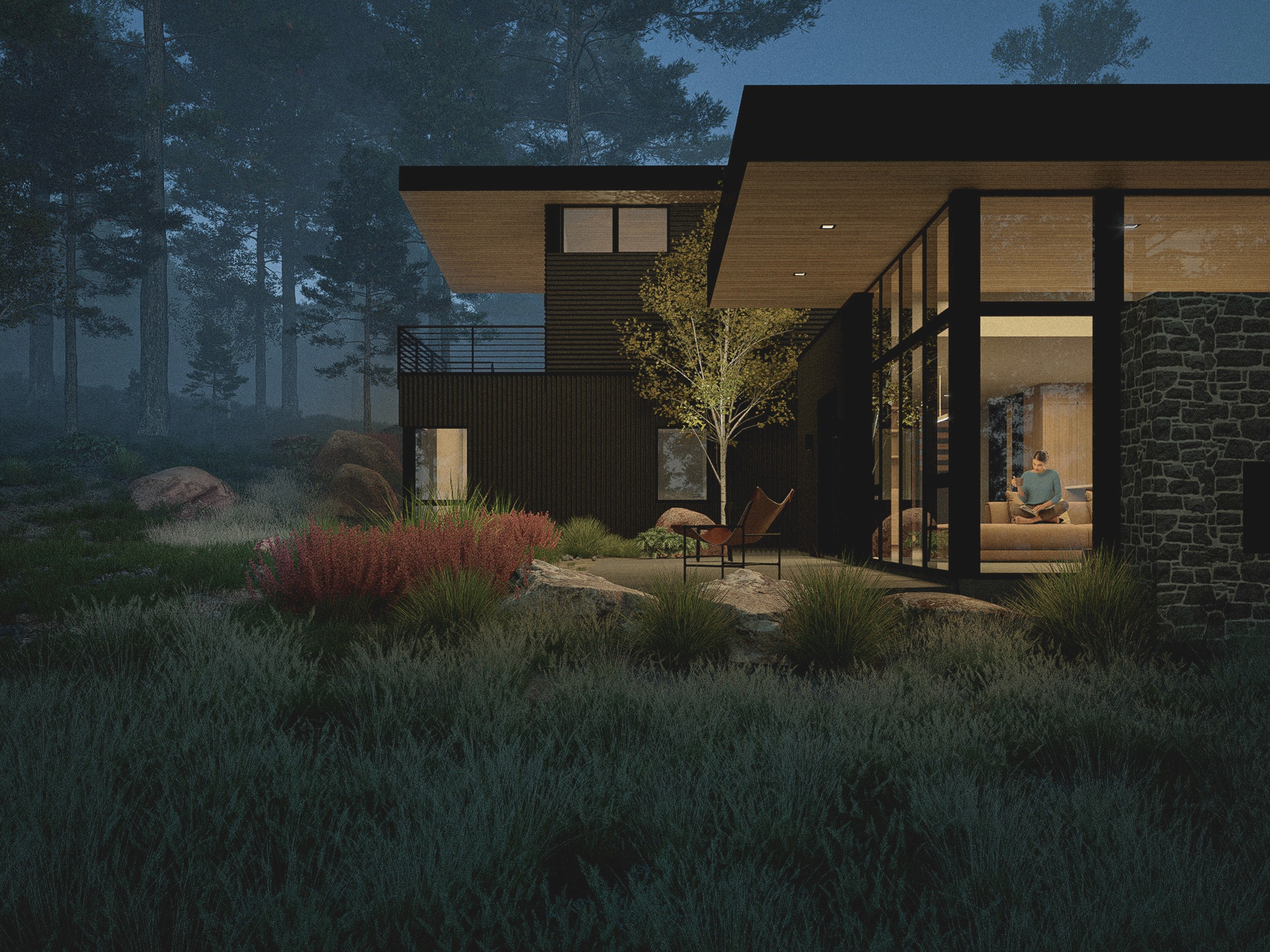 Dark evening view of the lower living room flat roof form and upper primary suite cantilevered roof form in the backgorund.