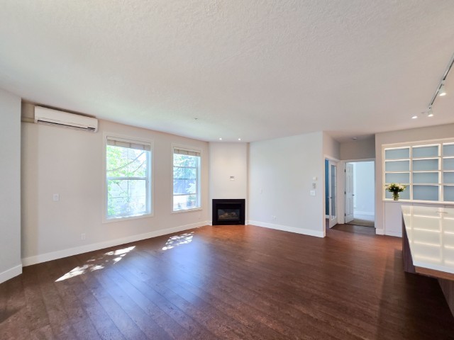 Image of KHD Homes interior design layout with hardwood floors, large windows, and modern construction elements.