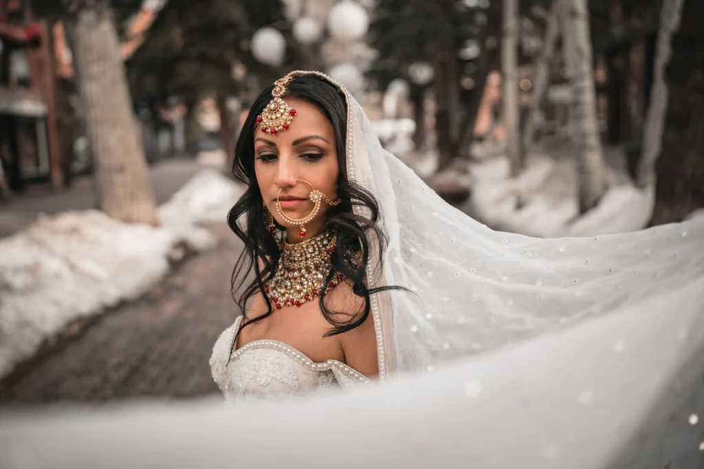 Bride portrait during T-Lazy 7 elopement in Aspen with veil and jewelry