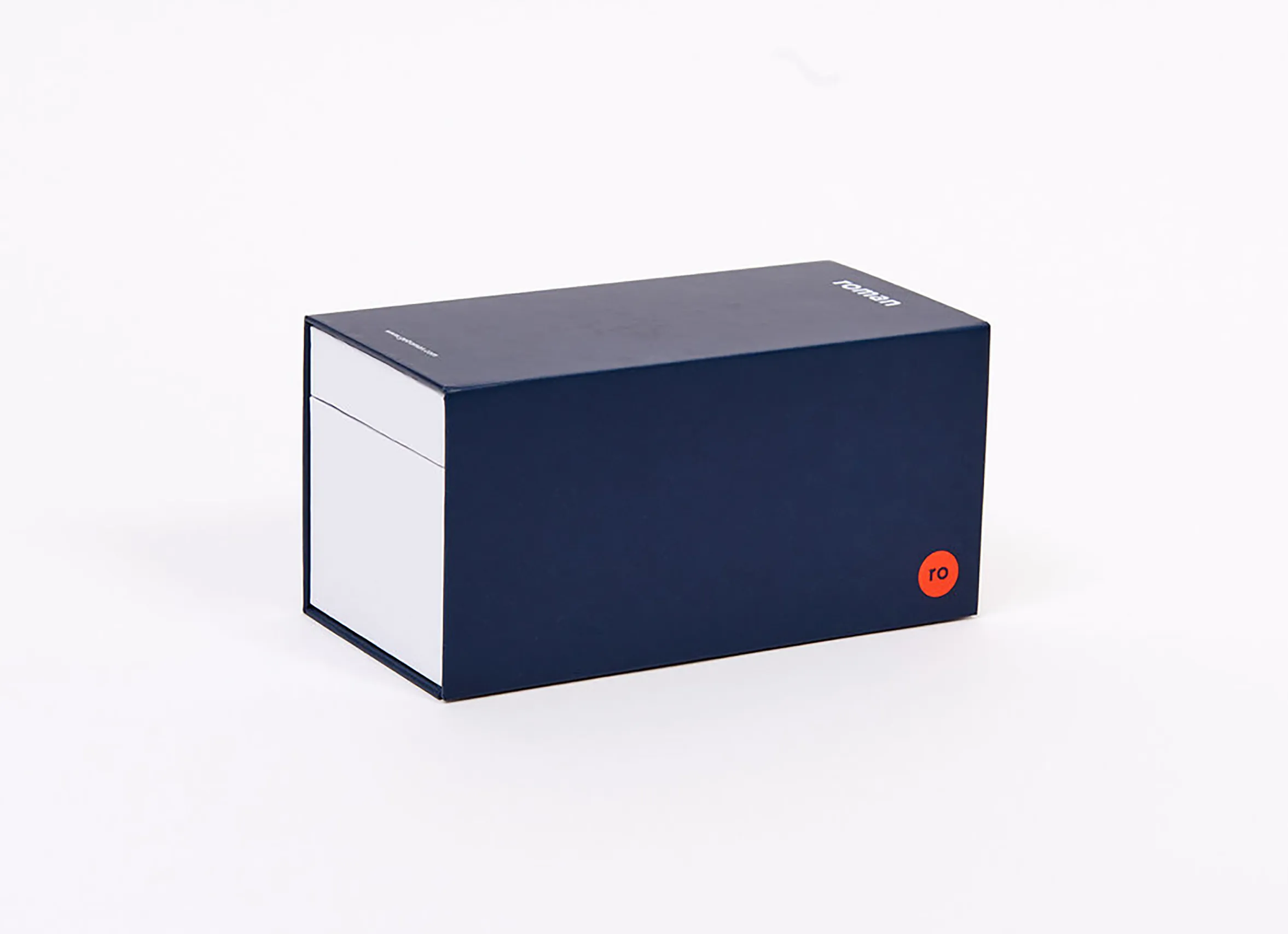 Closed dark blue Ro healthcare packaging box with red Ro logo on a white background