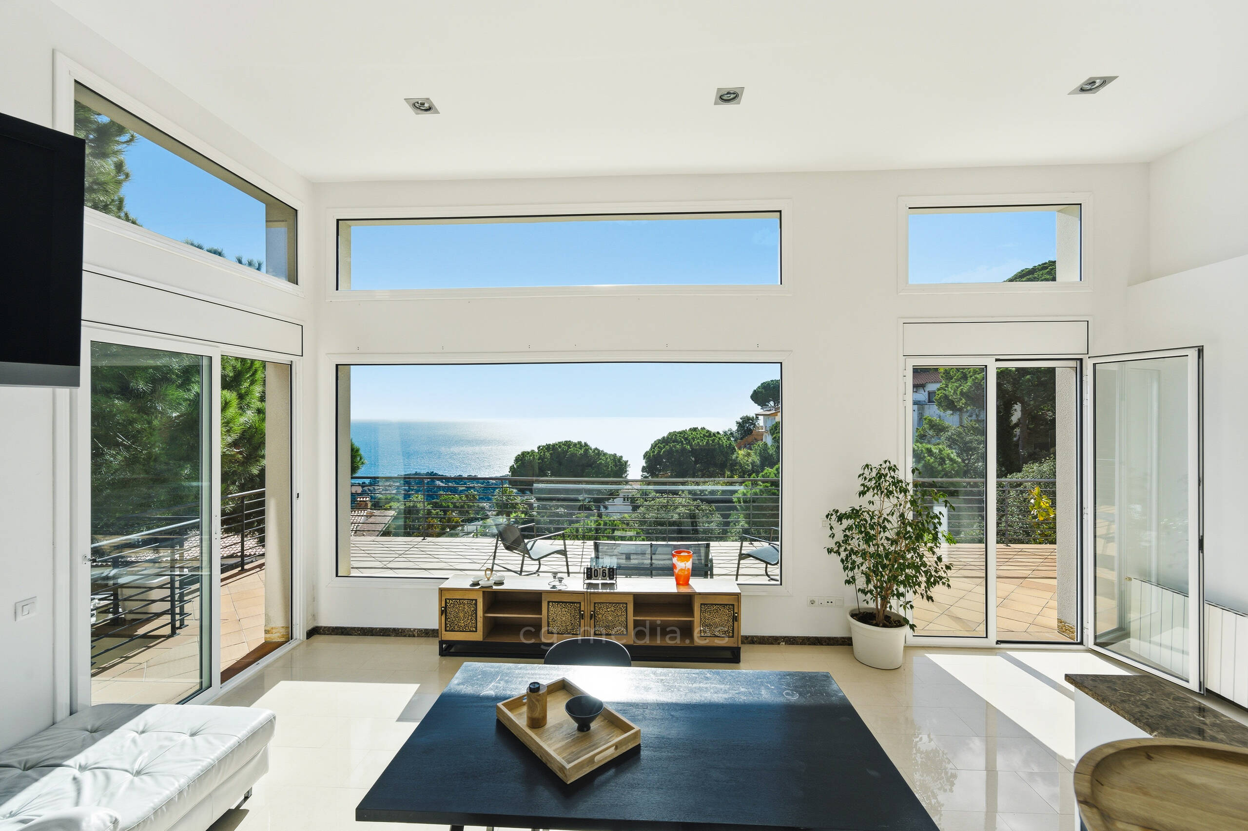A woman standing in front of a colorful wall