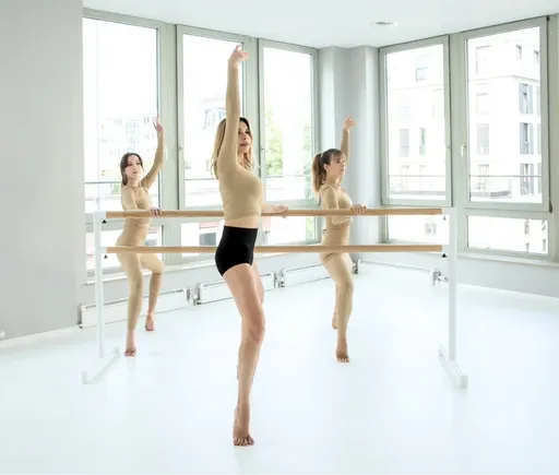 Adults ballet class participants practicing