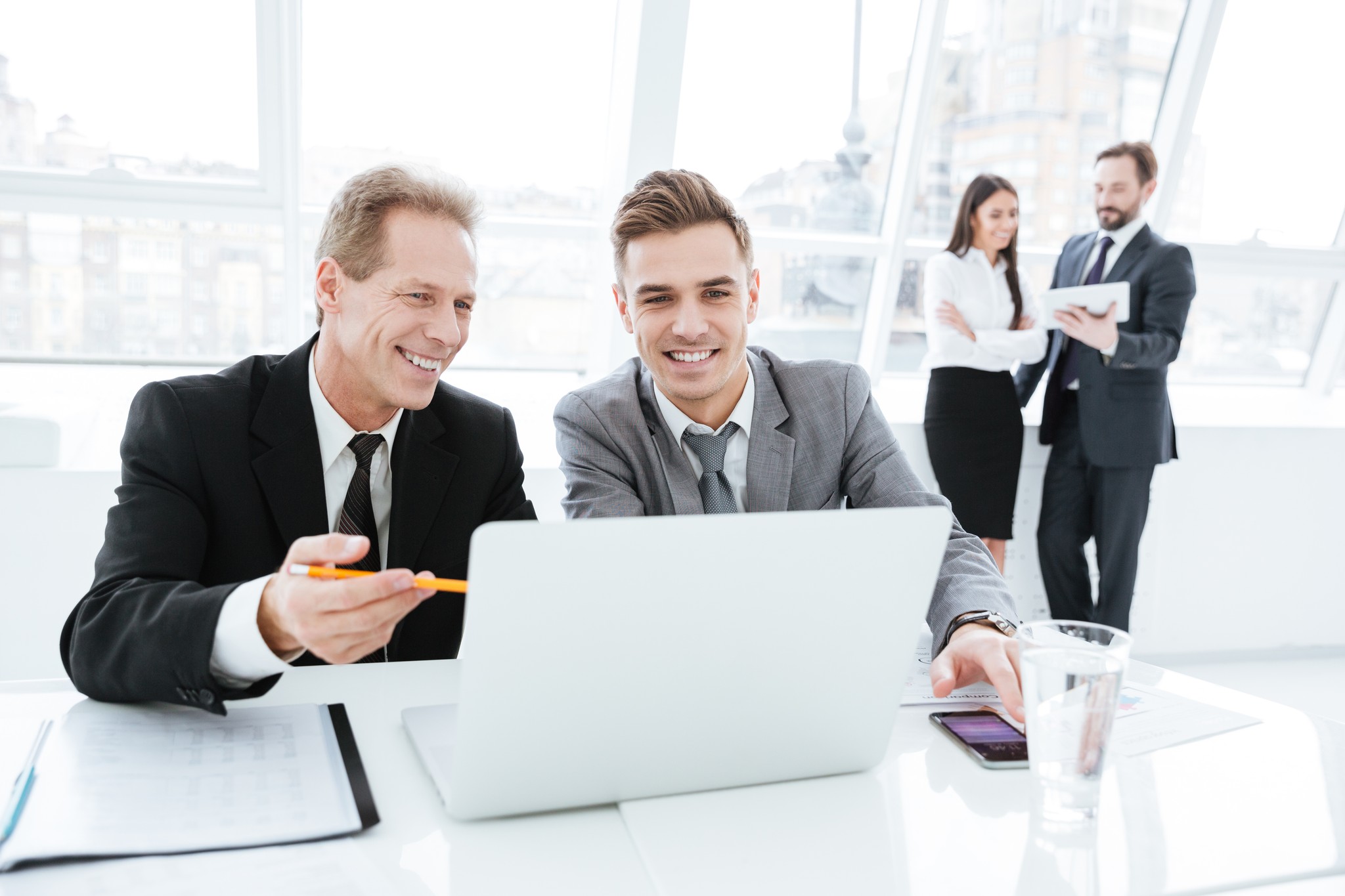 Business professionals working in a bright office