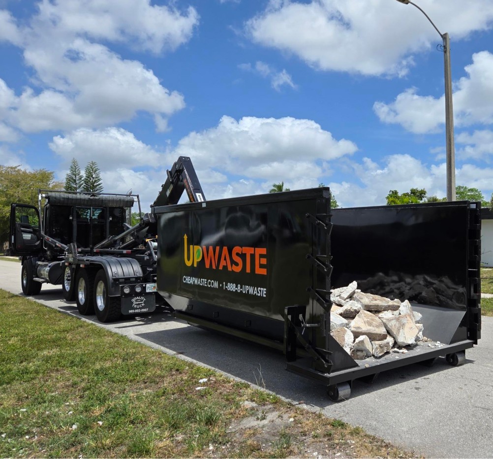Dumpster truck unloading stones