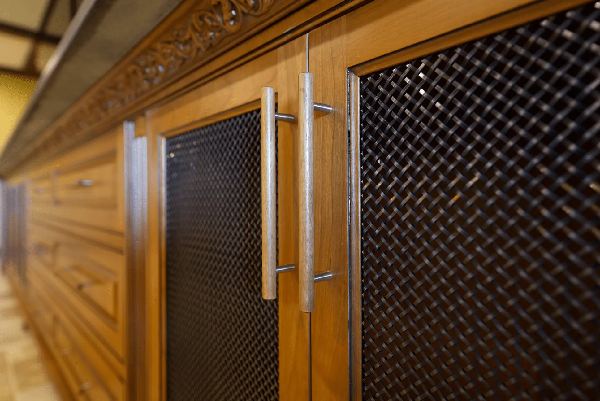 Close-up view from angle 2 of the sophisticated entertainment cabinetry, revealing the high-quality materials and finish in the San Juan Capistrano project. Photo by Todd Huge.