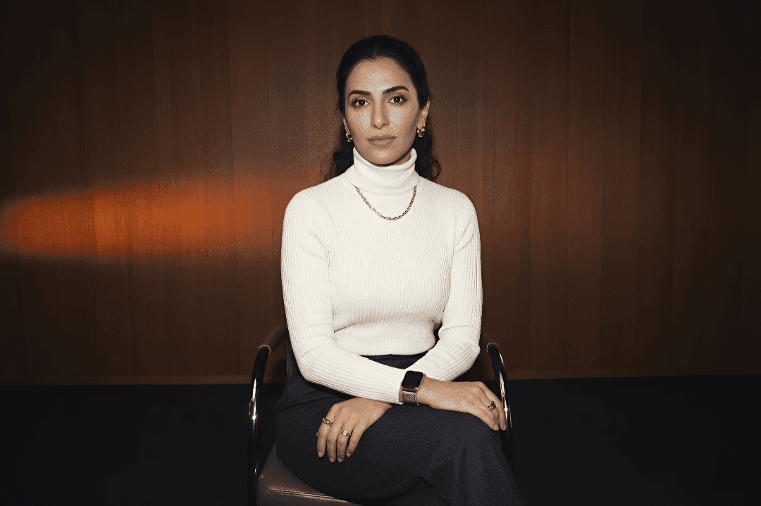 A close-up portrait of a smiling woman