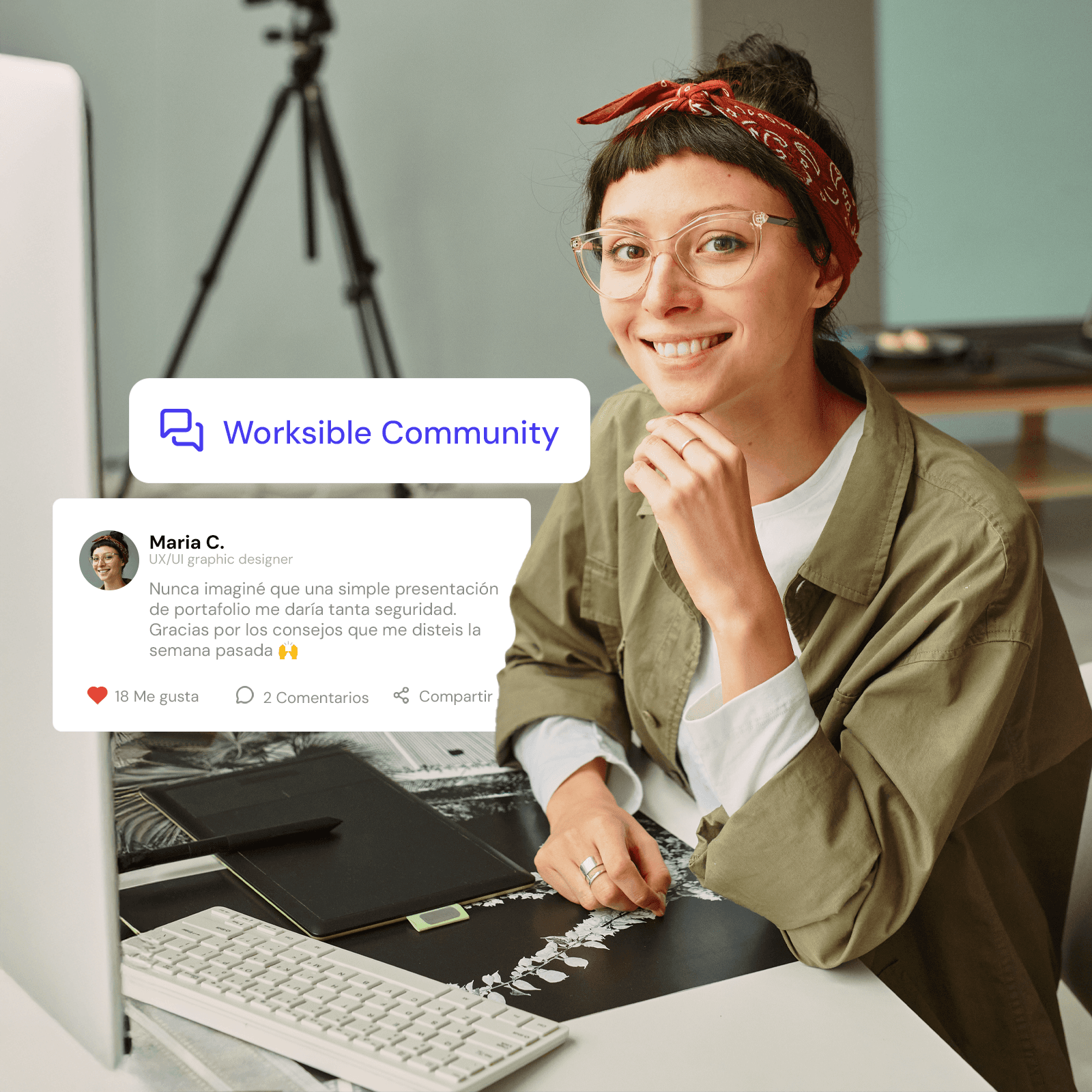 Two women are standing side by side against a beige wall, smiling confidently, one wearing a green shirt and the other in a dark blazer, with soft lighting casting gentle shadows.