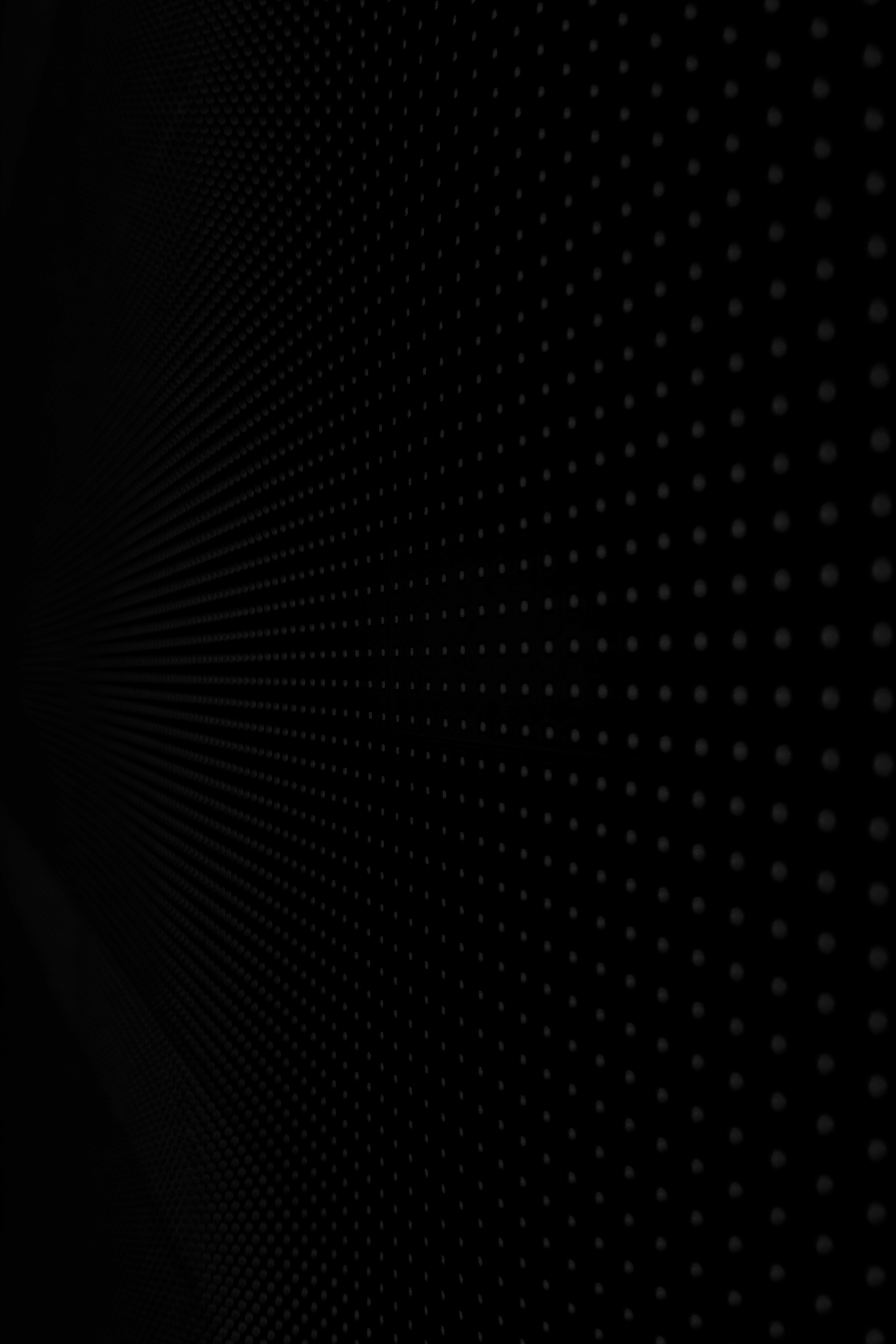 a sculpture made of wire and glass on a black background