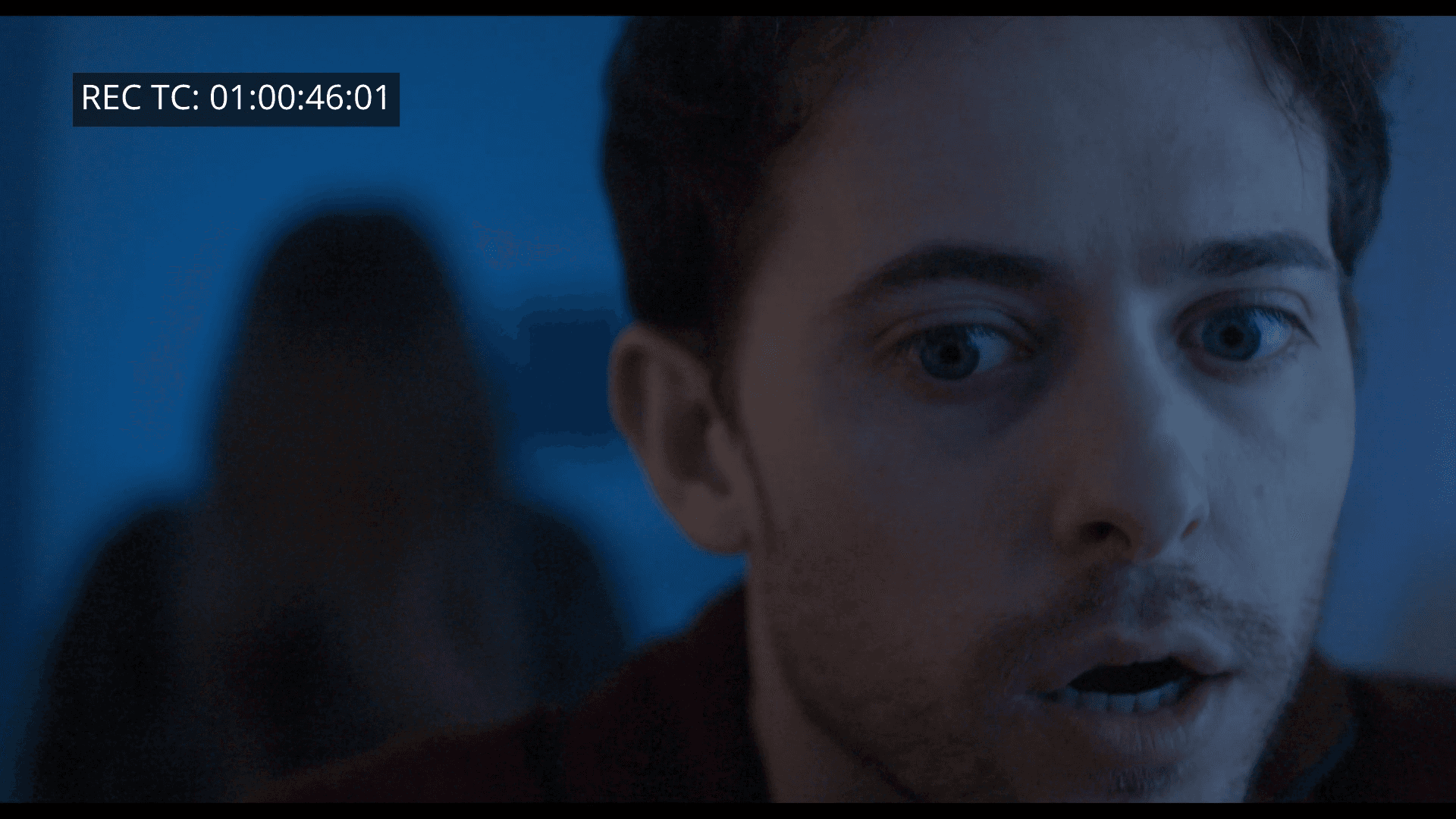 a woman holding a red flower