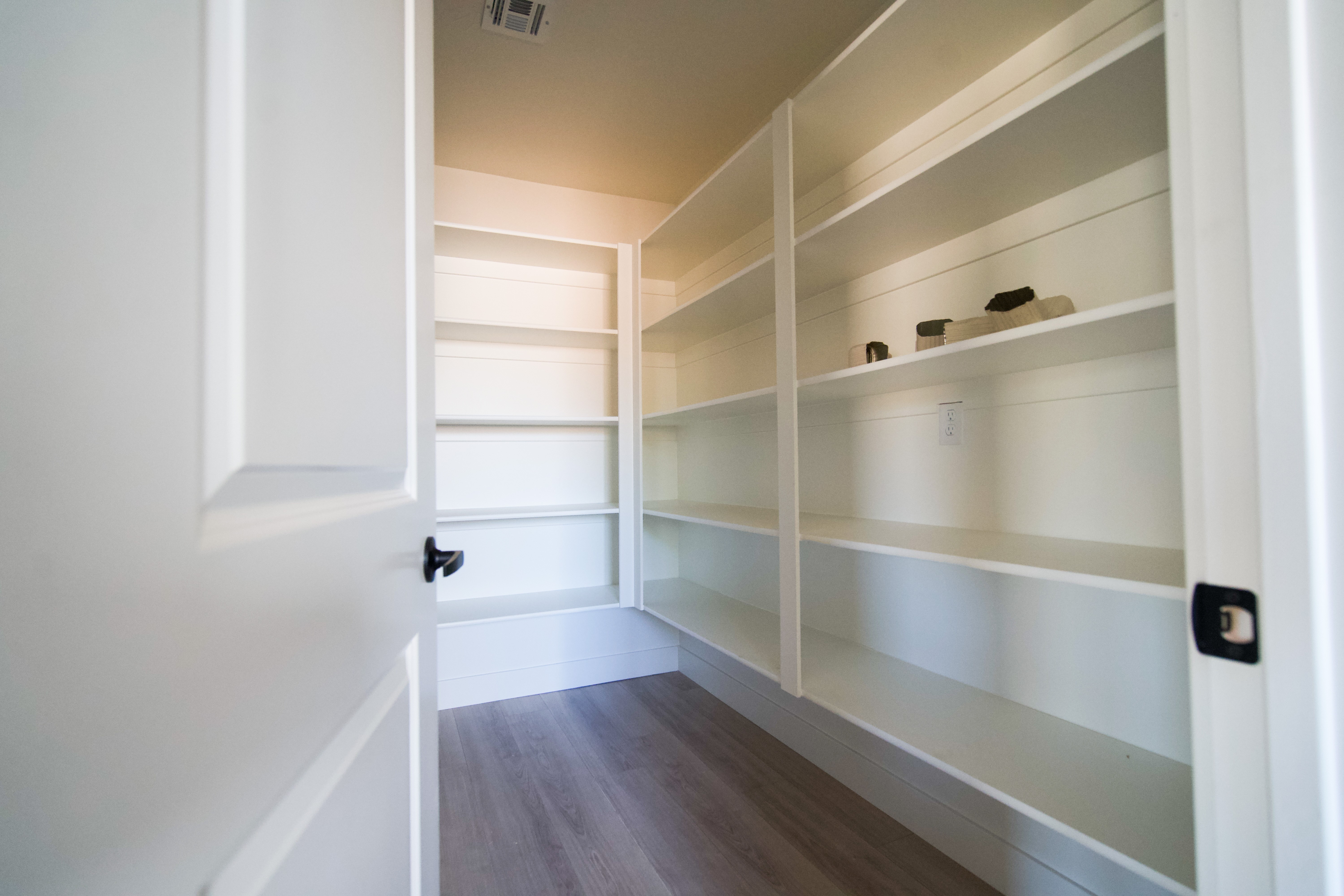 Walk-in pantry in a Hurricane, Utah remodel with built-in shelving and functional storage design.