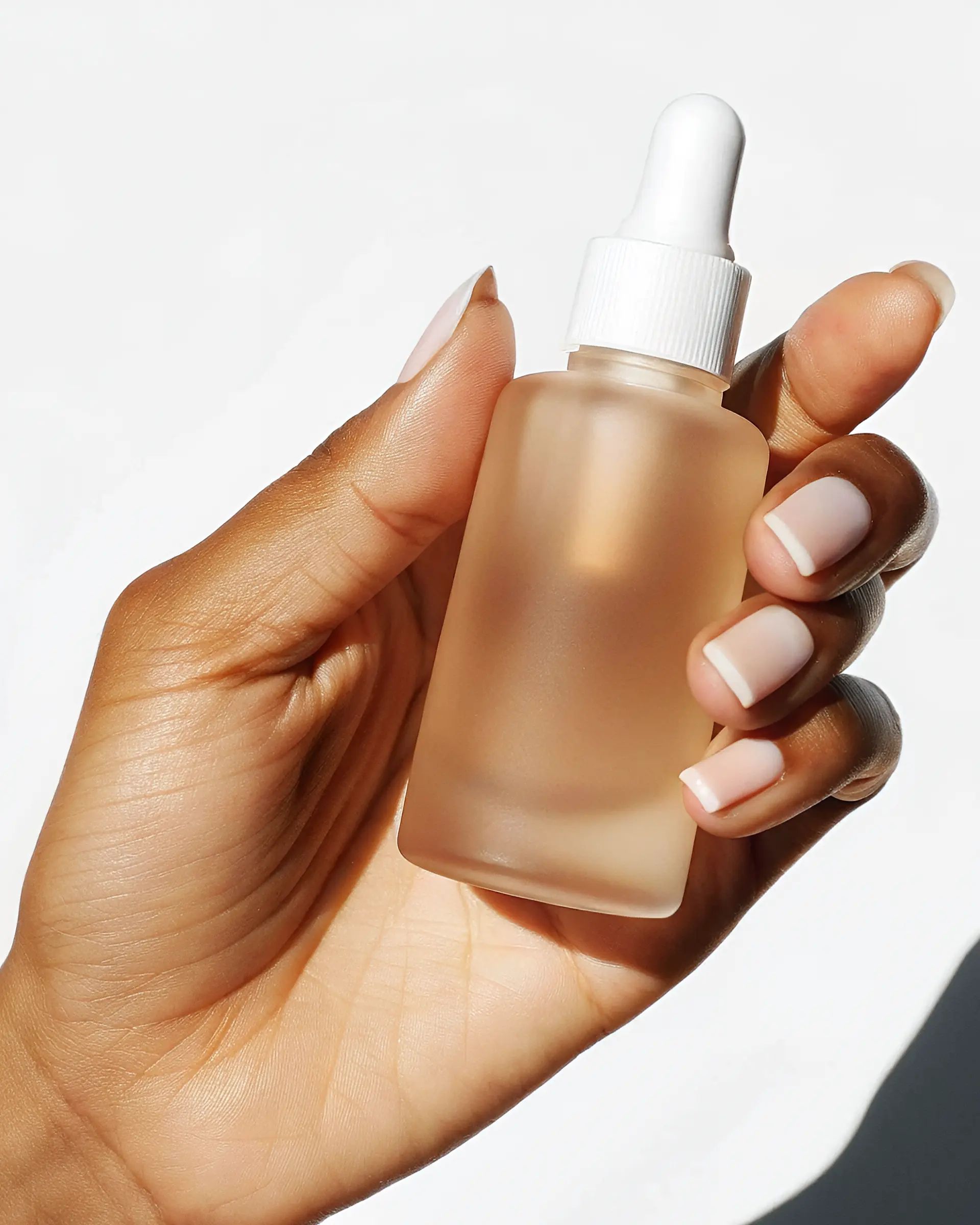 Serum bottle in hand