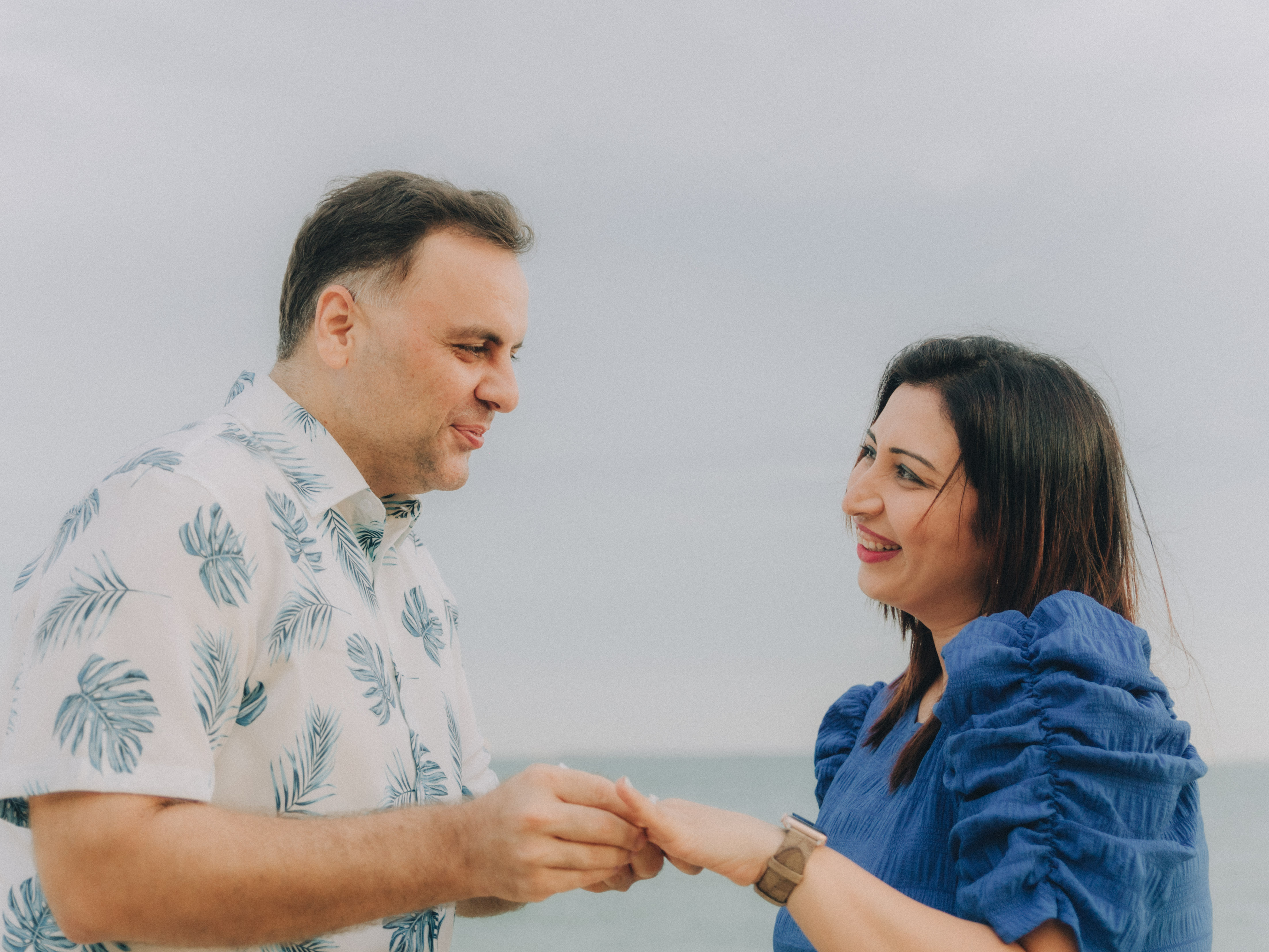 Full color photo showcasing the soft, neutral color palette used in the family's wardrobe by the sea.