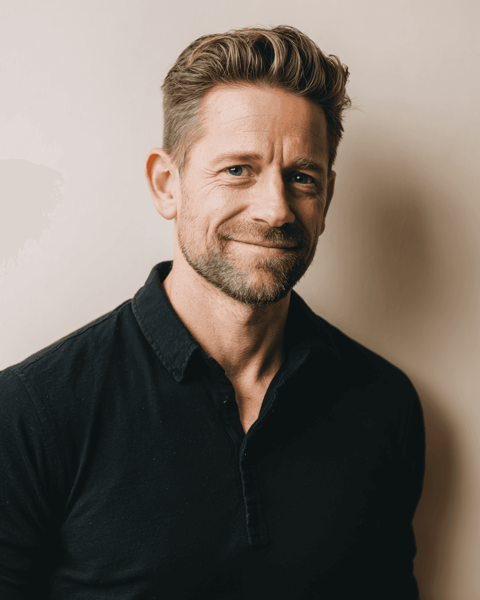 portrait photography of man wearing black suit jacket