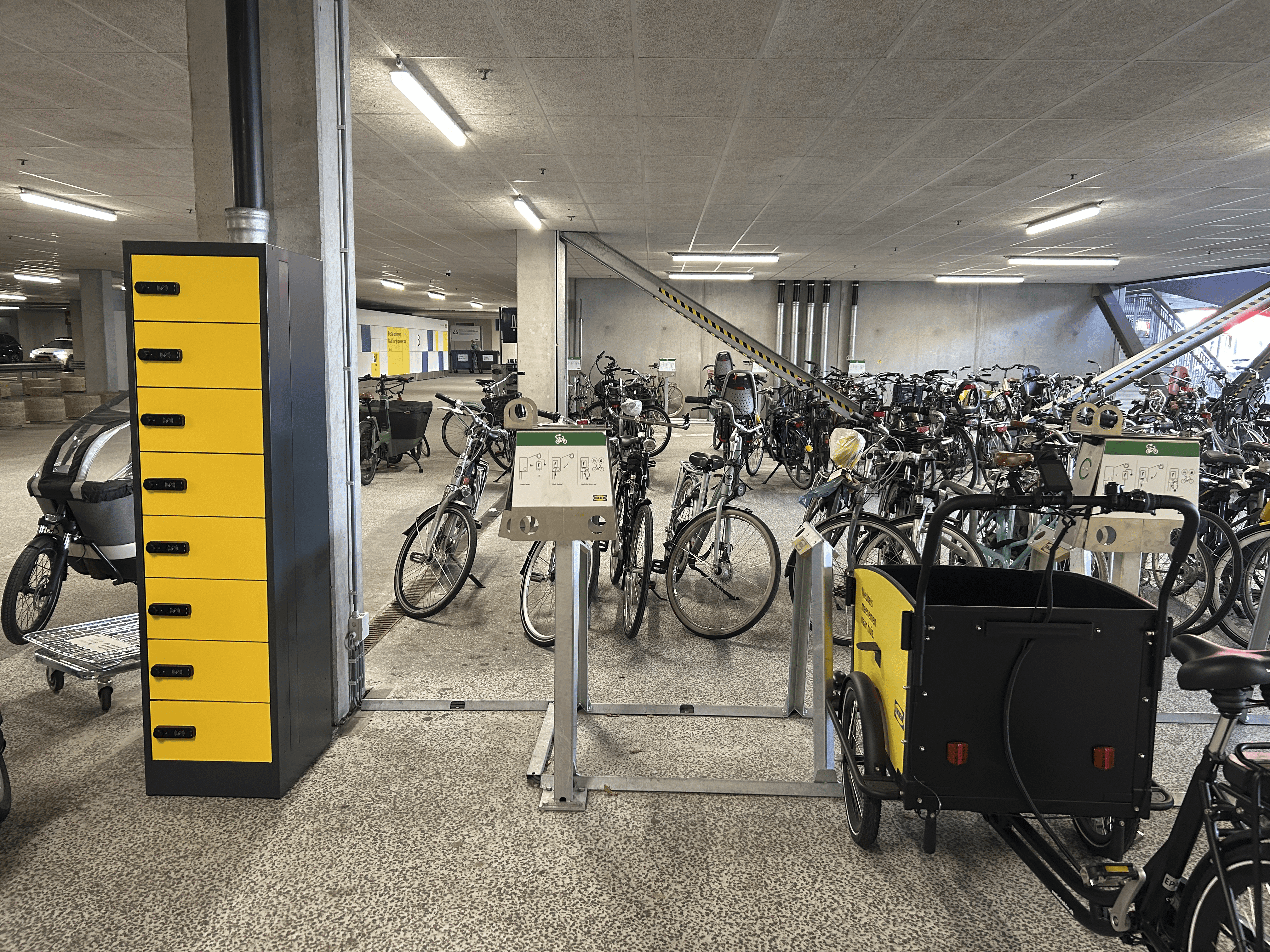 PowerShelter e-bike charging locker retrofitted in a parking garage, maximizing charging capacity within an existing footprint.