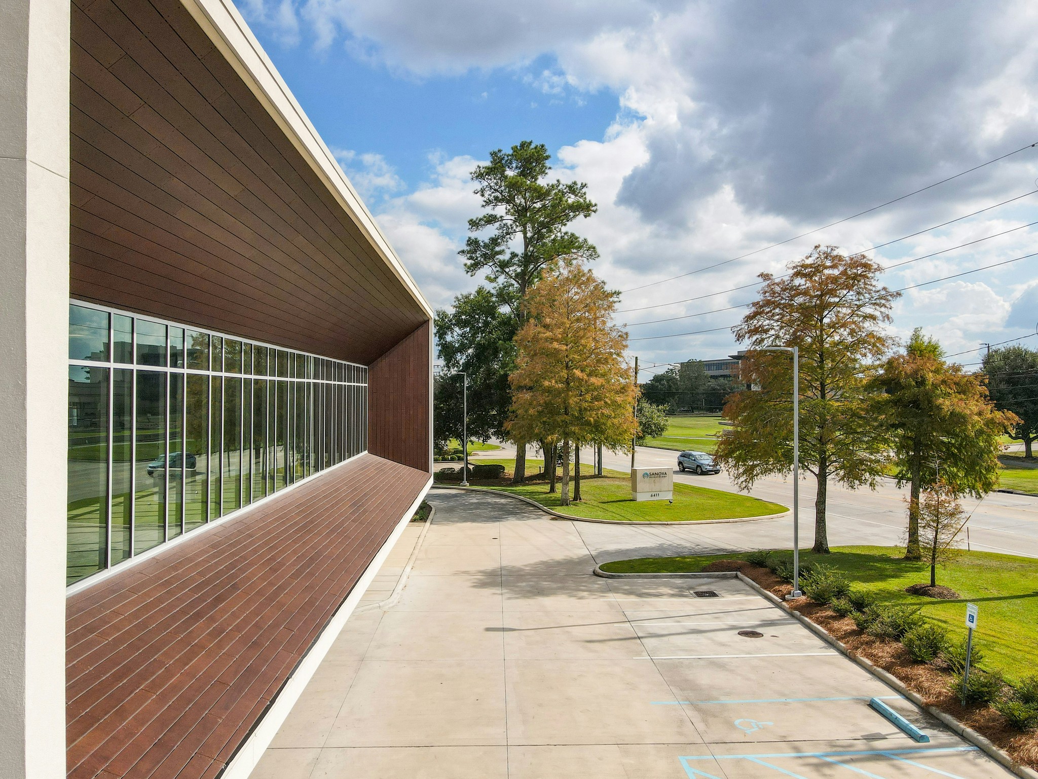 A landscaped area with trees and a well-maintained pathway.