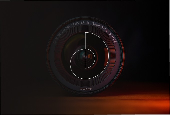 Interior view from living area toward the lake, large glass facade, minimal furniture.