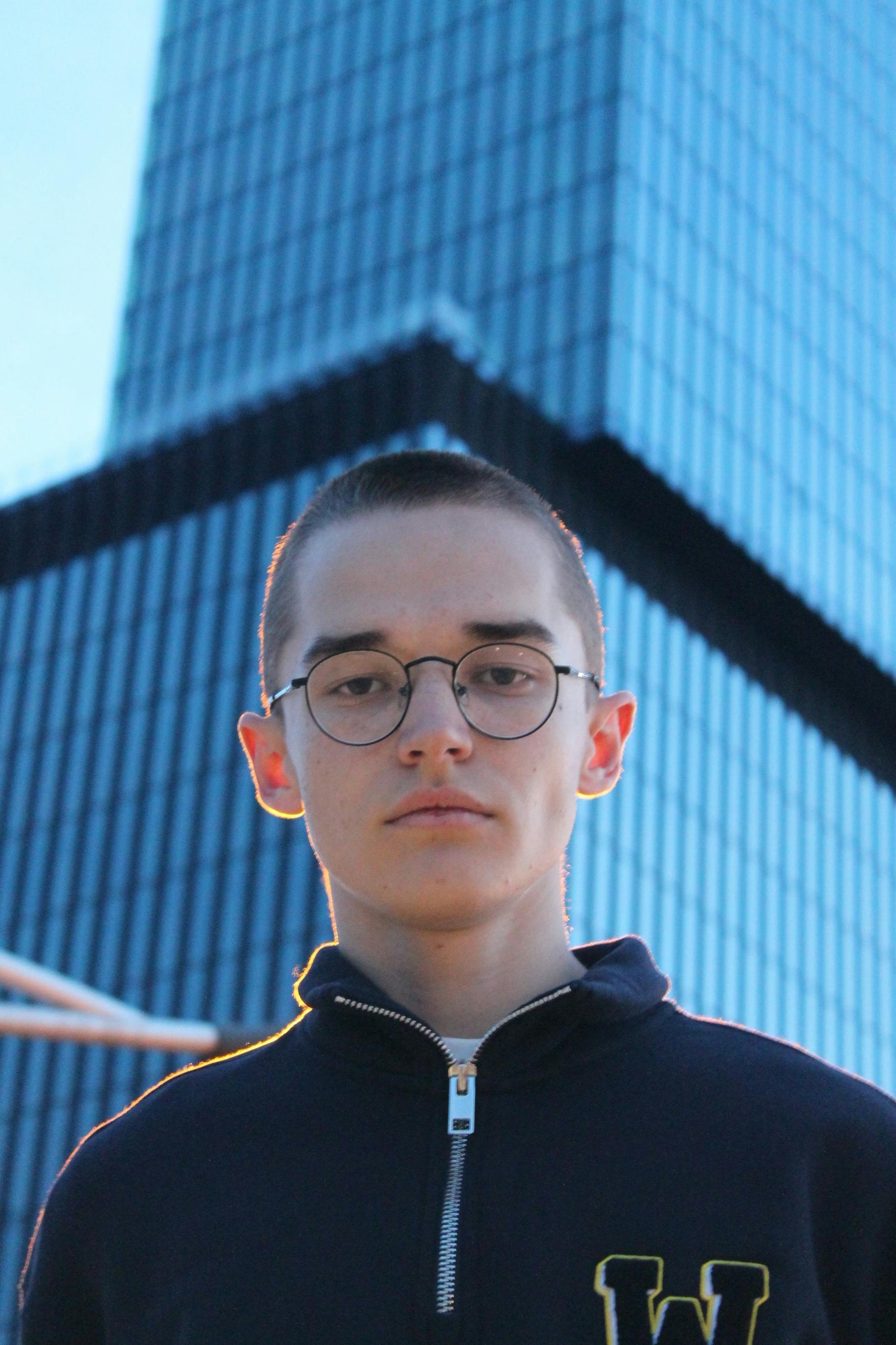 A guy on the background of buildings