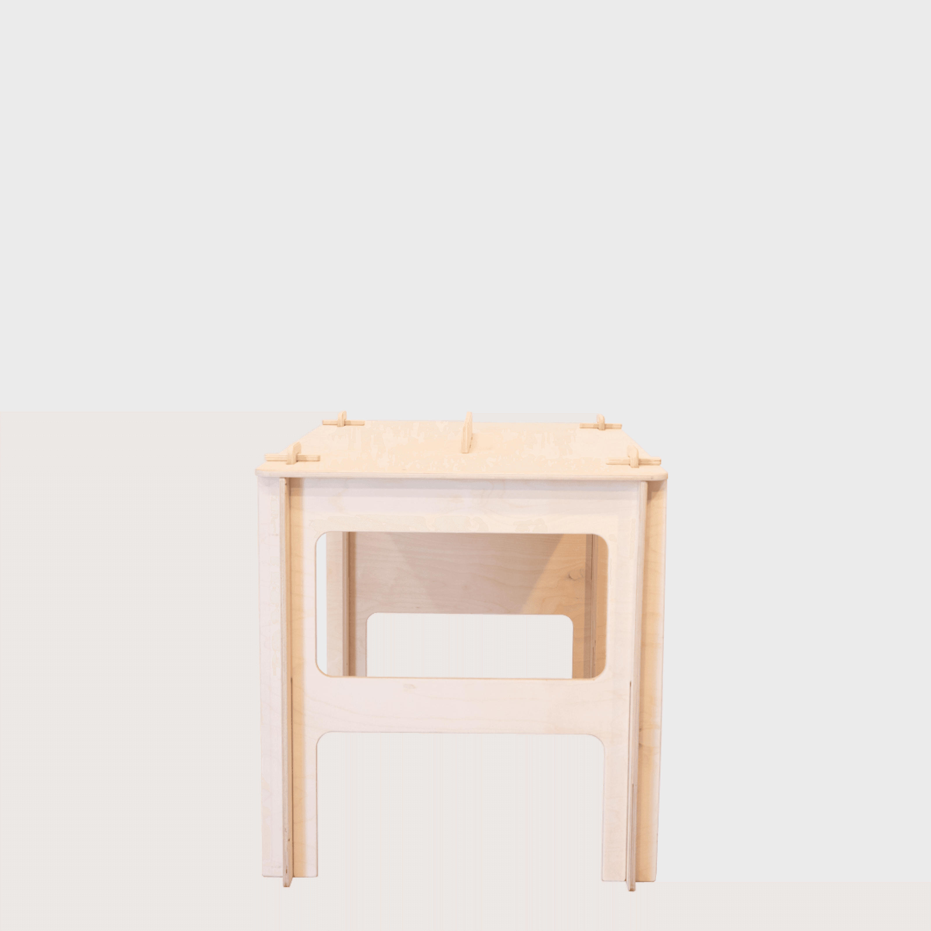 100 Tree Furniture quick assembly desk product shot from the side. It is assembled and on a grey background in the regular desk position.